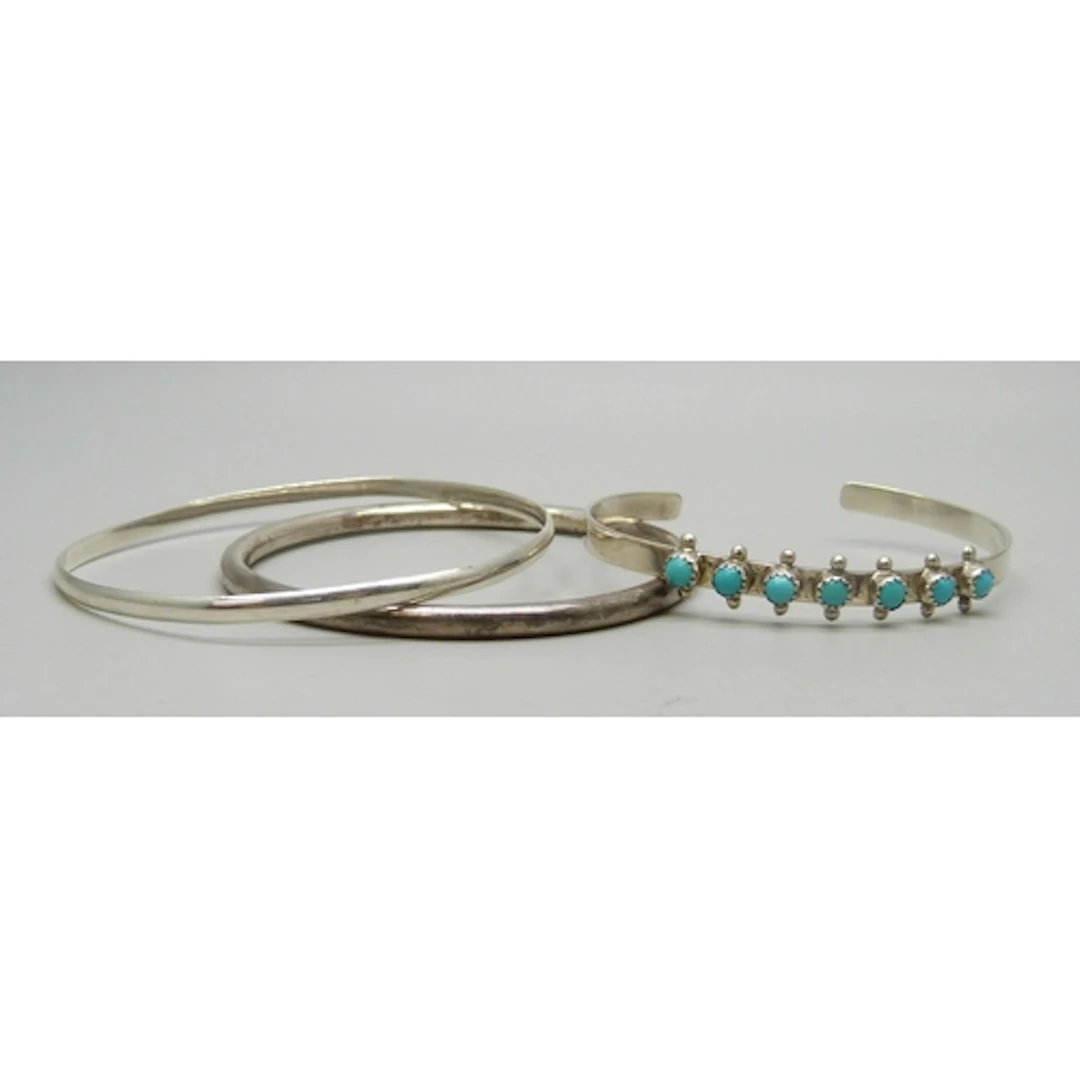 A silver and turquoise bangle marked Frances Becay, and two ...