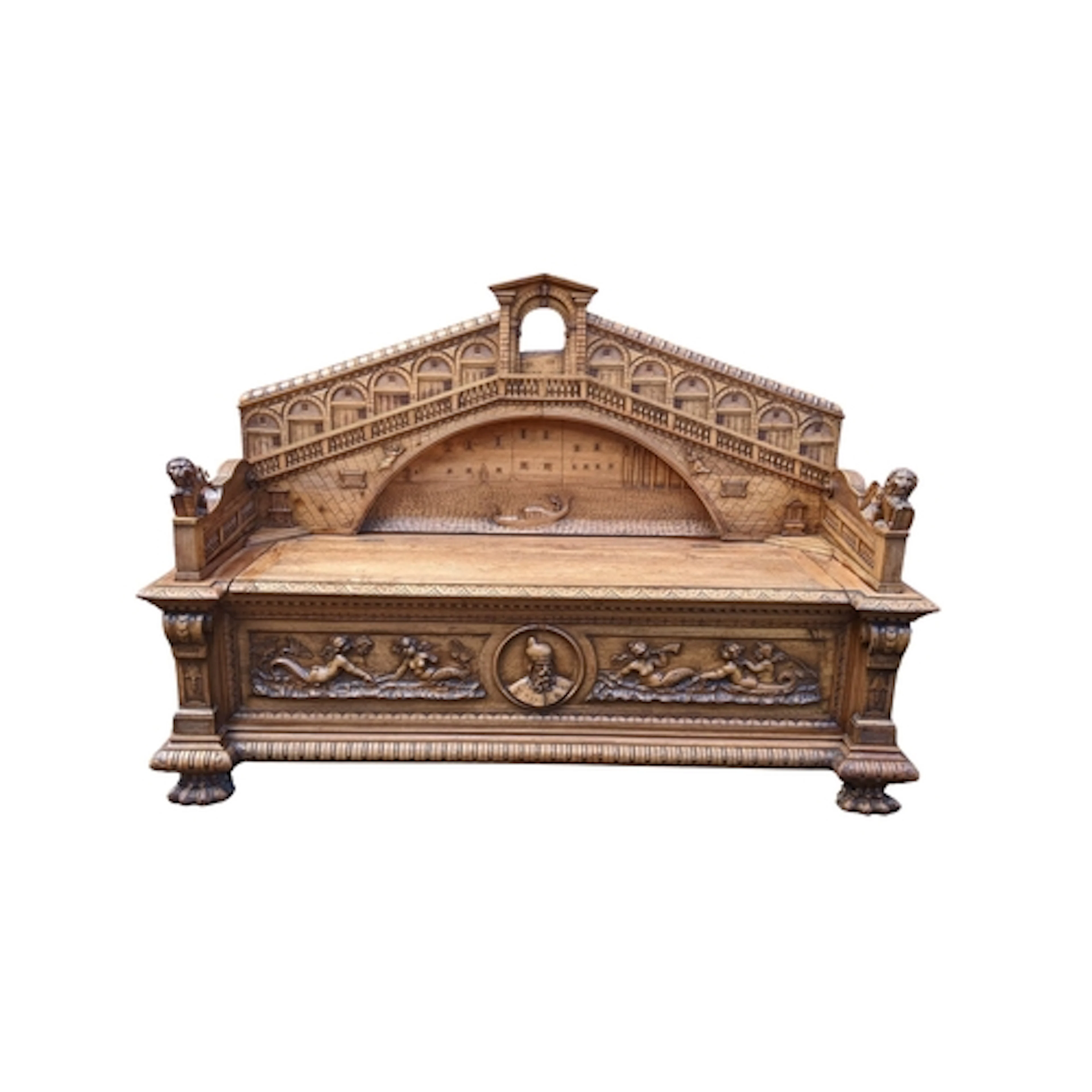 A circa 1900 Venetian carved oak hall settle, the hinged sea...