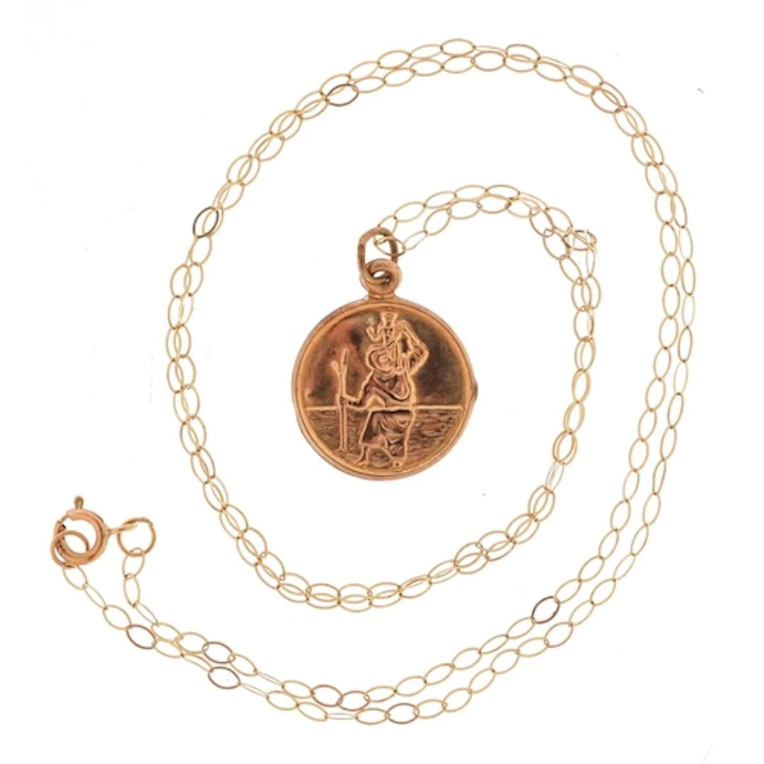 Yellow metal St. Christopher pendant on a 9ct gold necklace,...