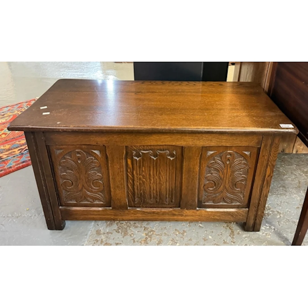 Small reproduction 18th century style oak coffer with foliat...
