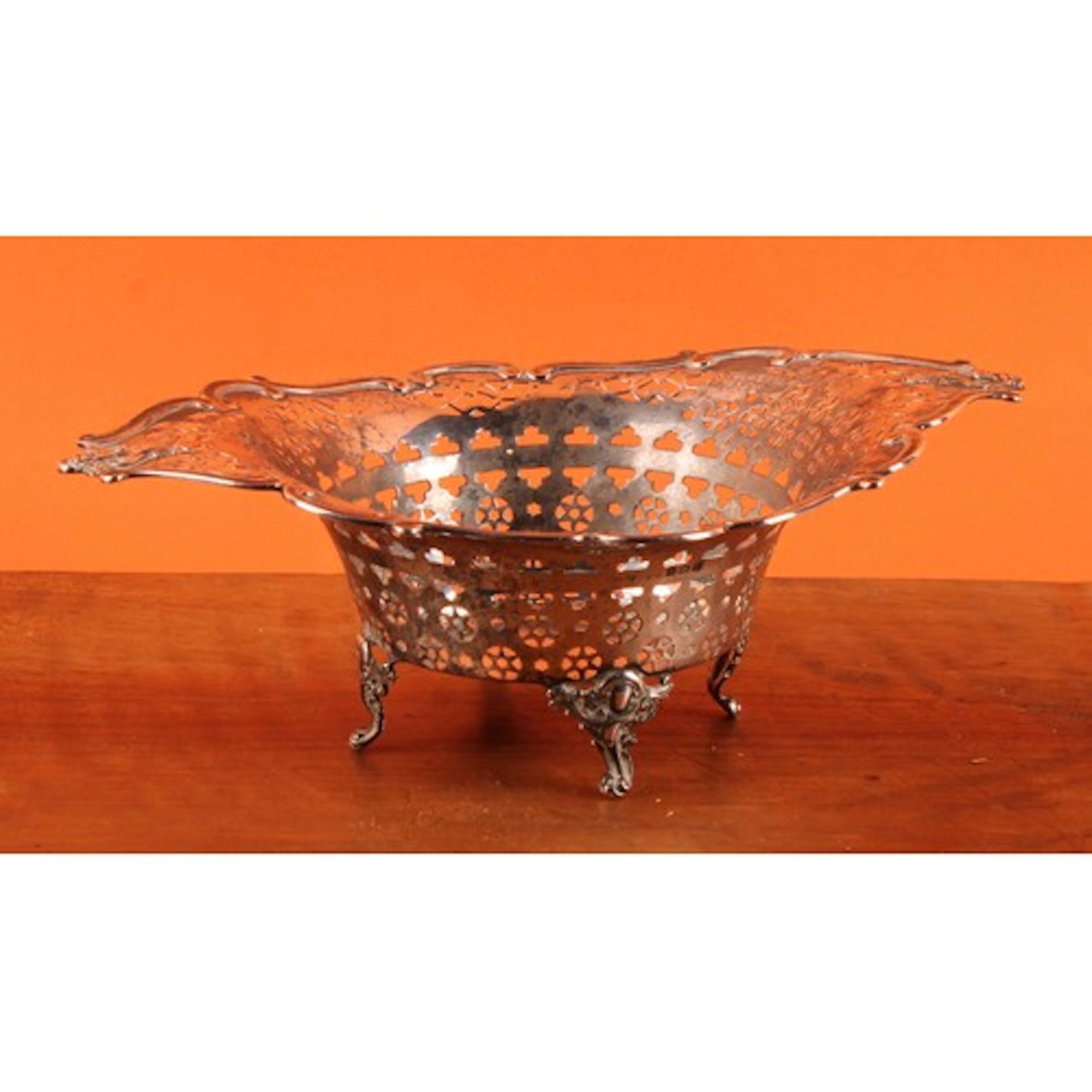 An Edwardian silver bonbon dish or basket, scrolling rim, ma...