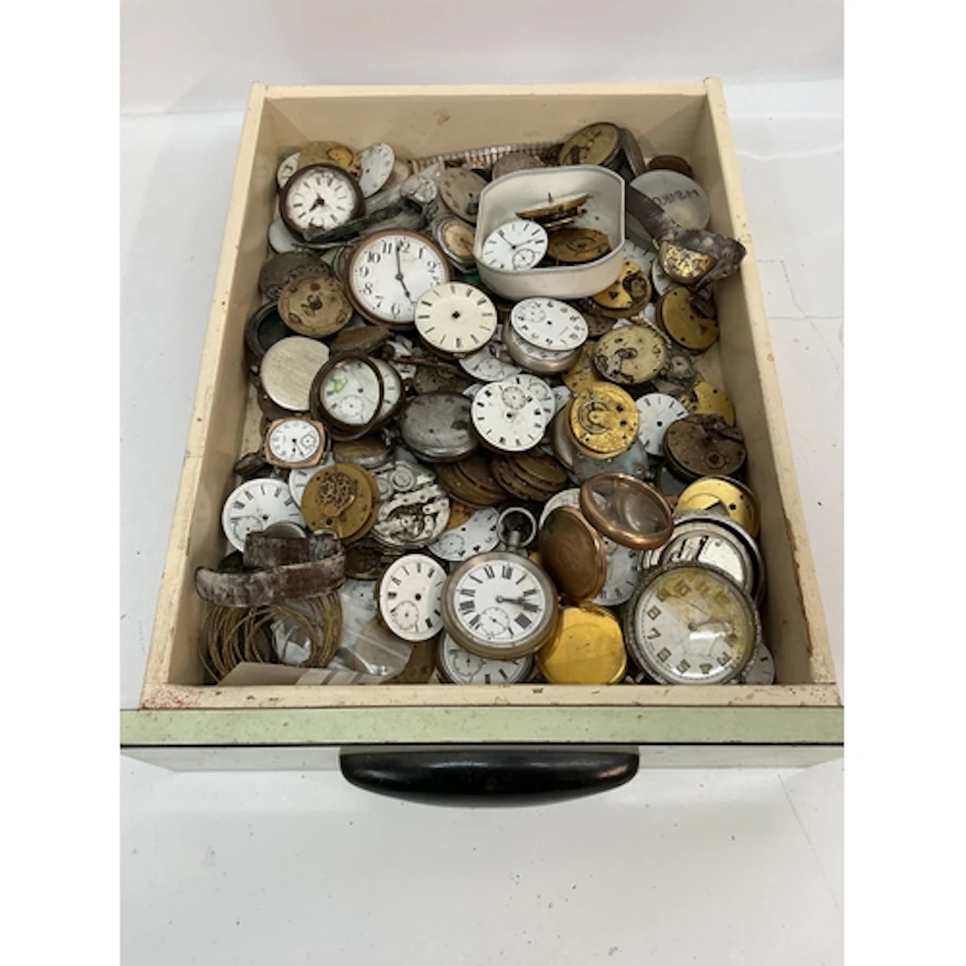 A tray containing assorted antique watch movements including...