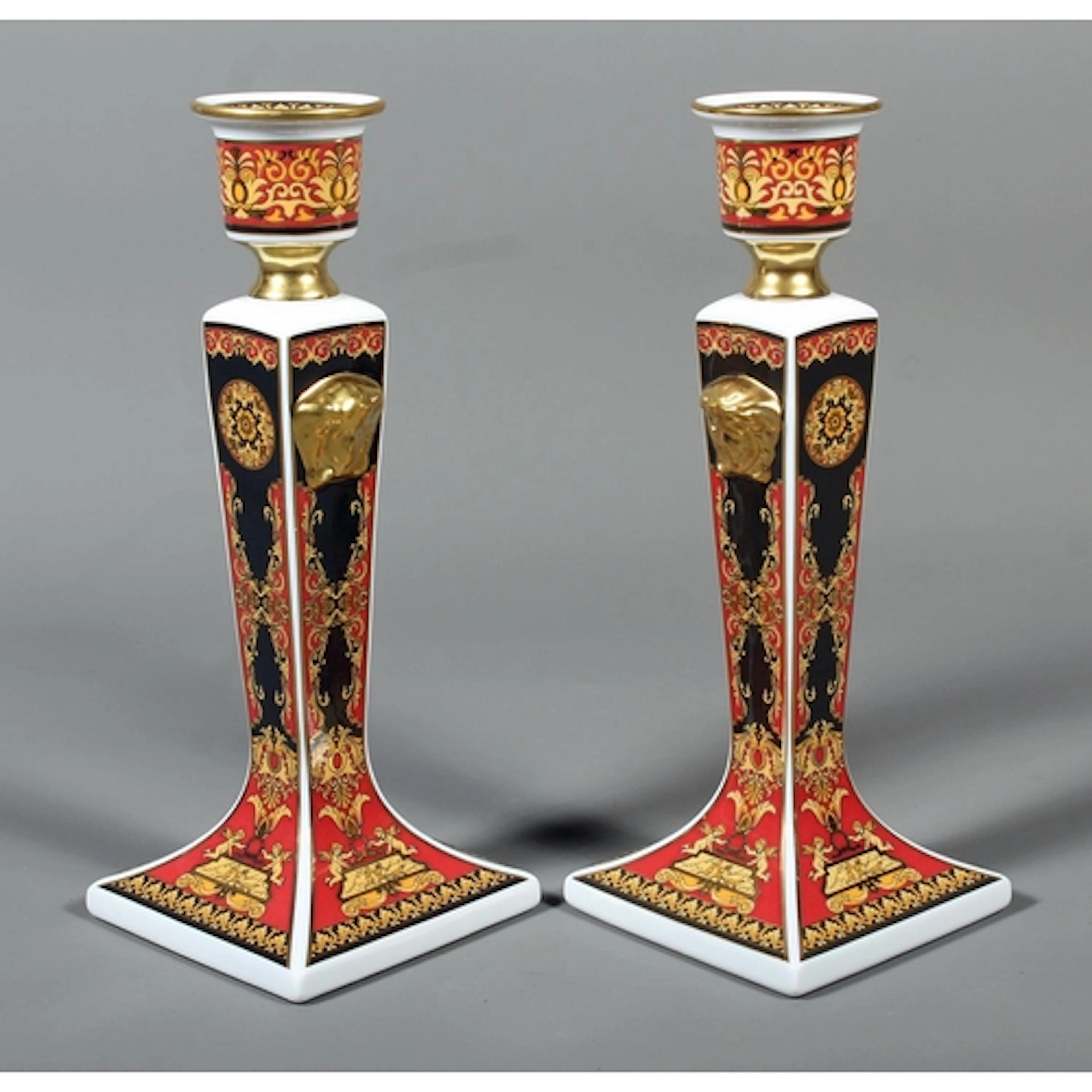 Pair of Rosenthal Versace Medusa black, red and gold pattern...