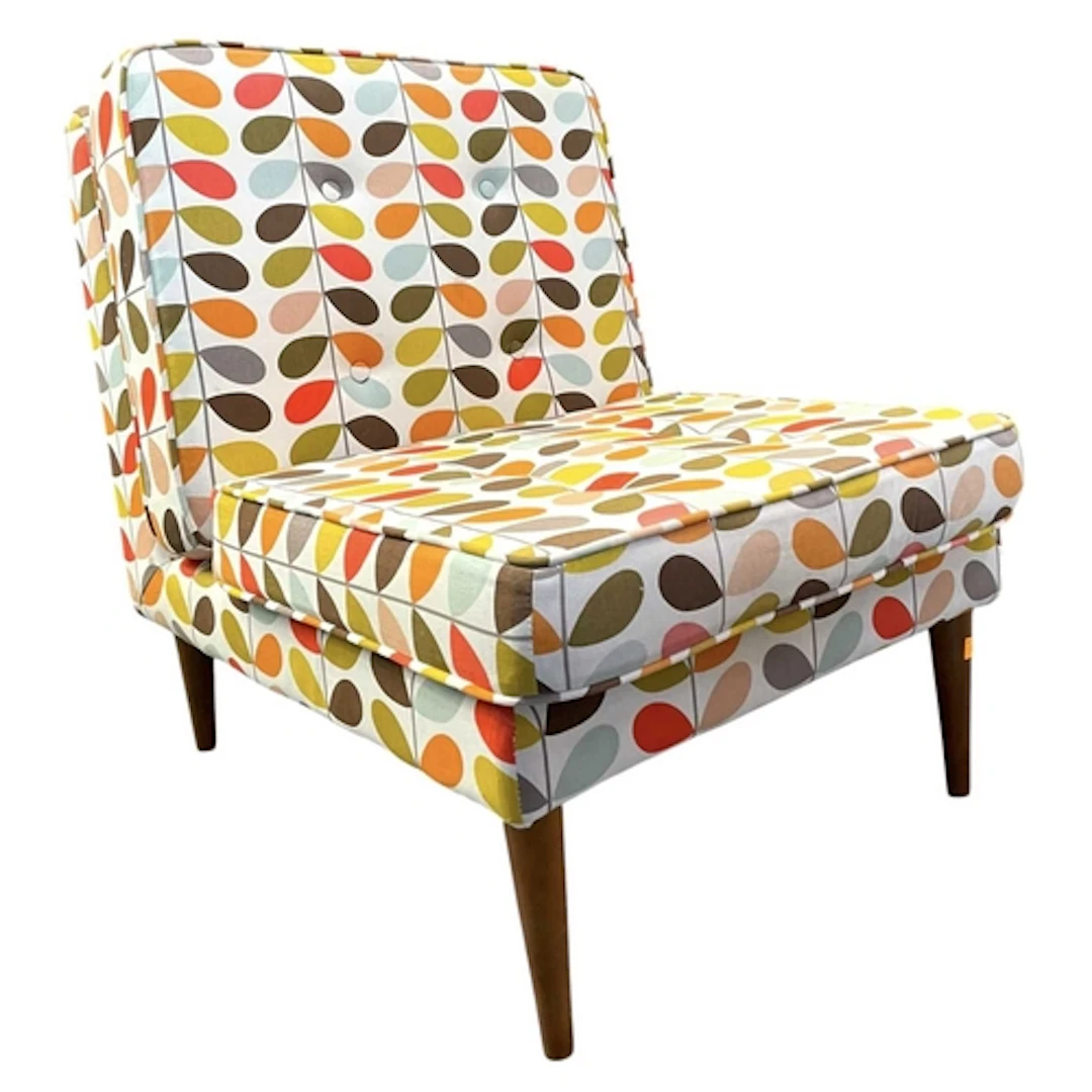 A 20th century Heals of London cork easy chair. The chair is...