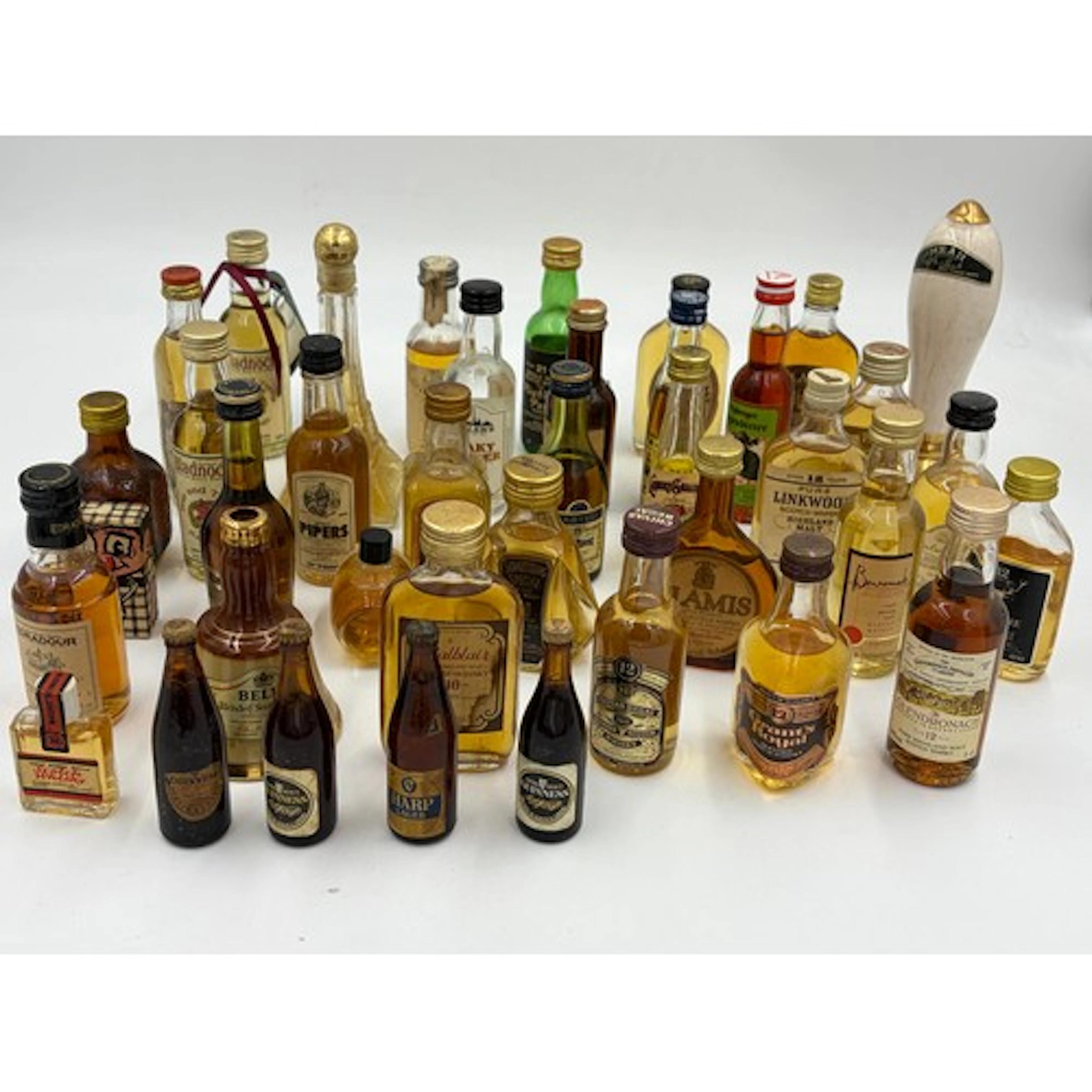 A selection of 39 miniature bottles of assorted spirits and ...