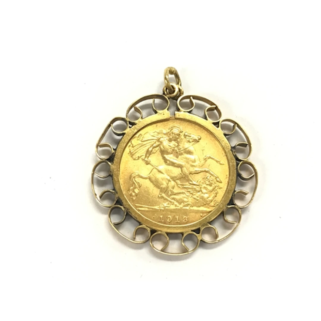 A 1913 half sovereign in 9ct mount. 6.10g