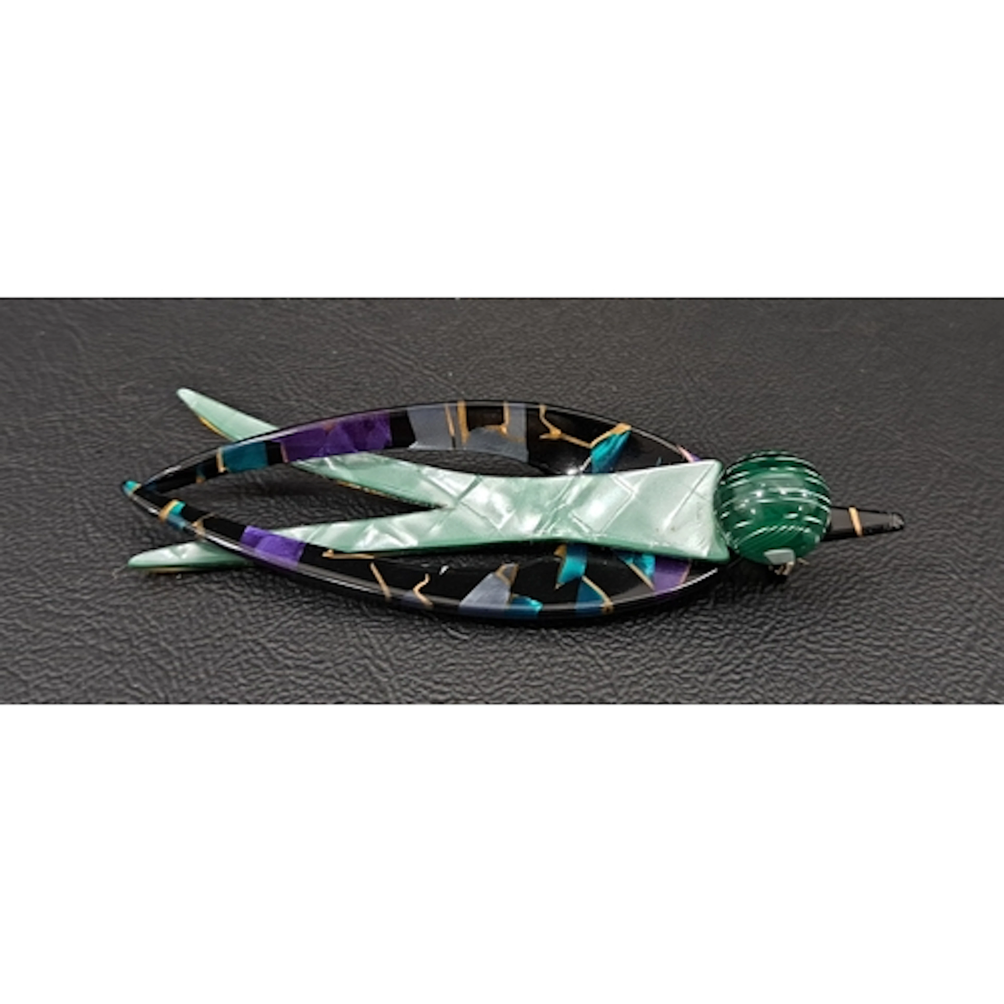 LEA STEIN SWALLOW BROOCH in tones of green, purple and black...