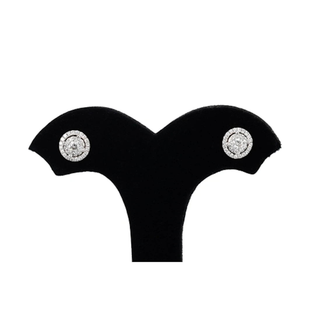 A PAIR OF DIAMOND CLUSTER STUD EARRINGS, the central round b...