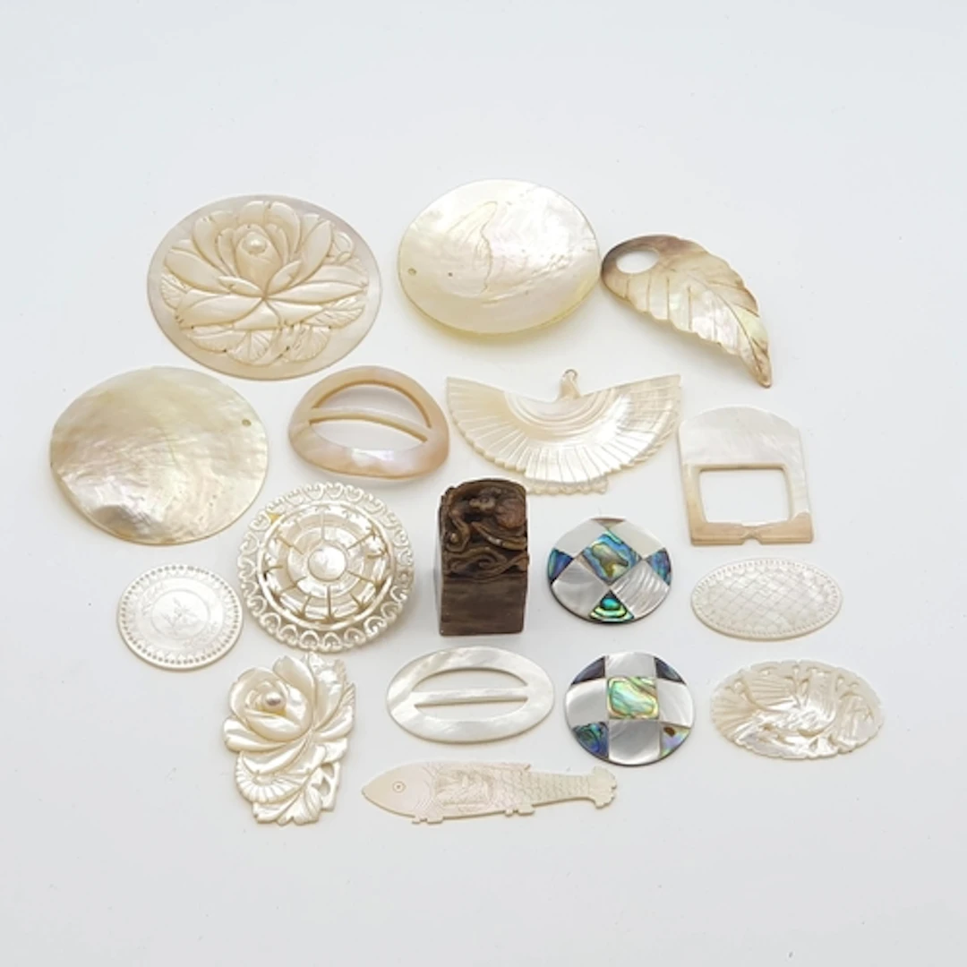 A group of carved and engraved Mother of Pearl Gaming Counte...