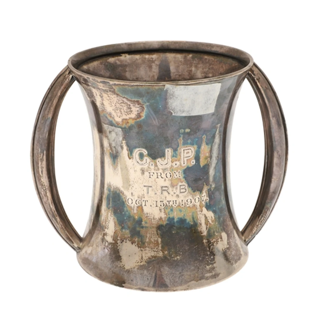 AN EDWARDIAN SILVER PRESENTATION CUP. Of waisted cylindrical...