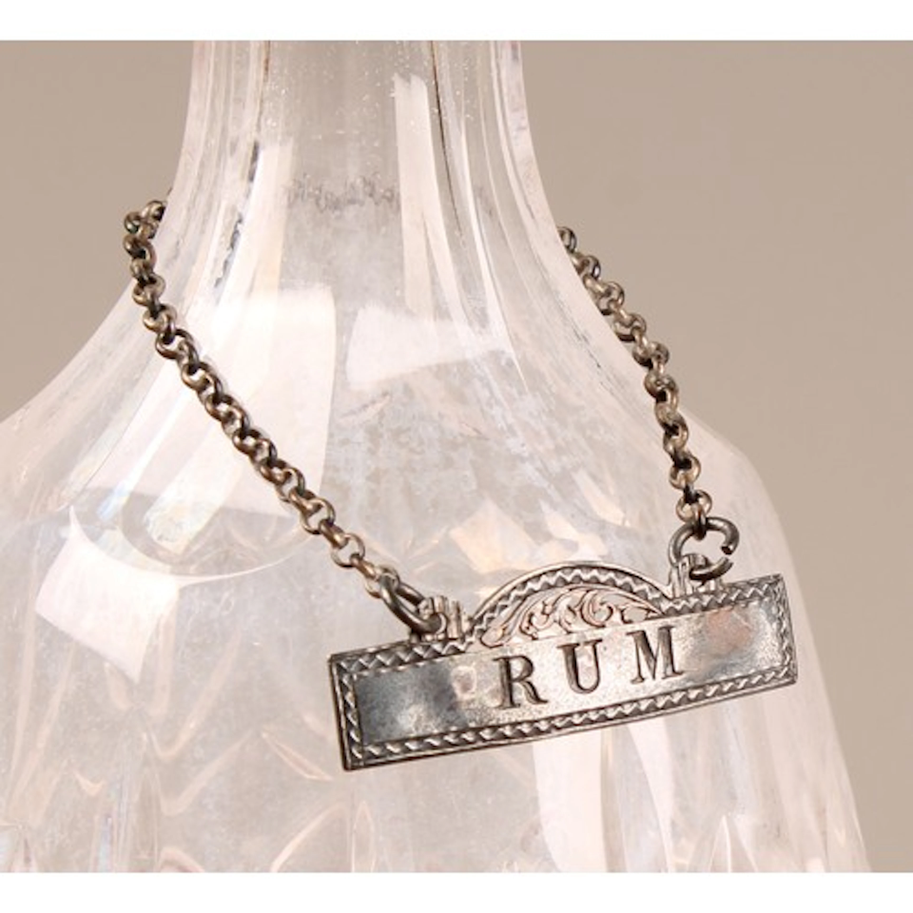 Hester Bateman - a George III wine label, Rum, 5cm wide, mak...