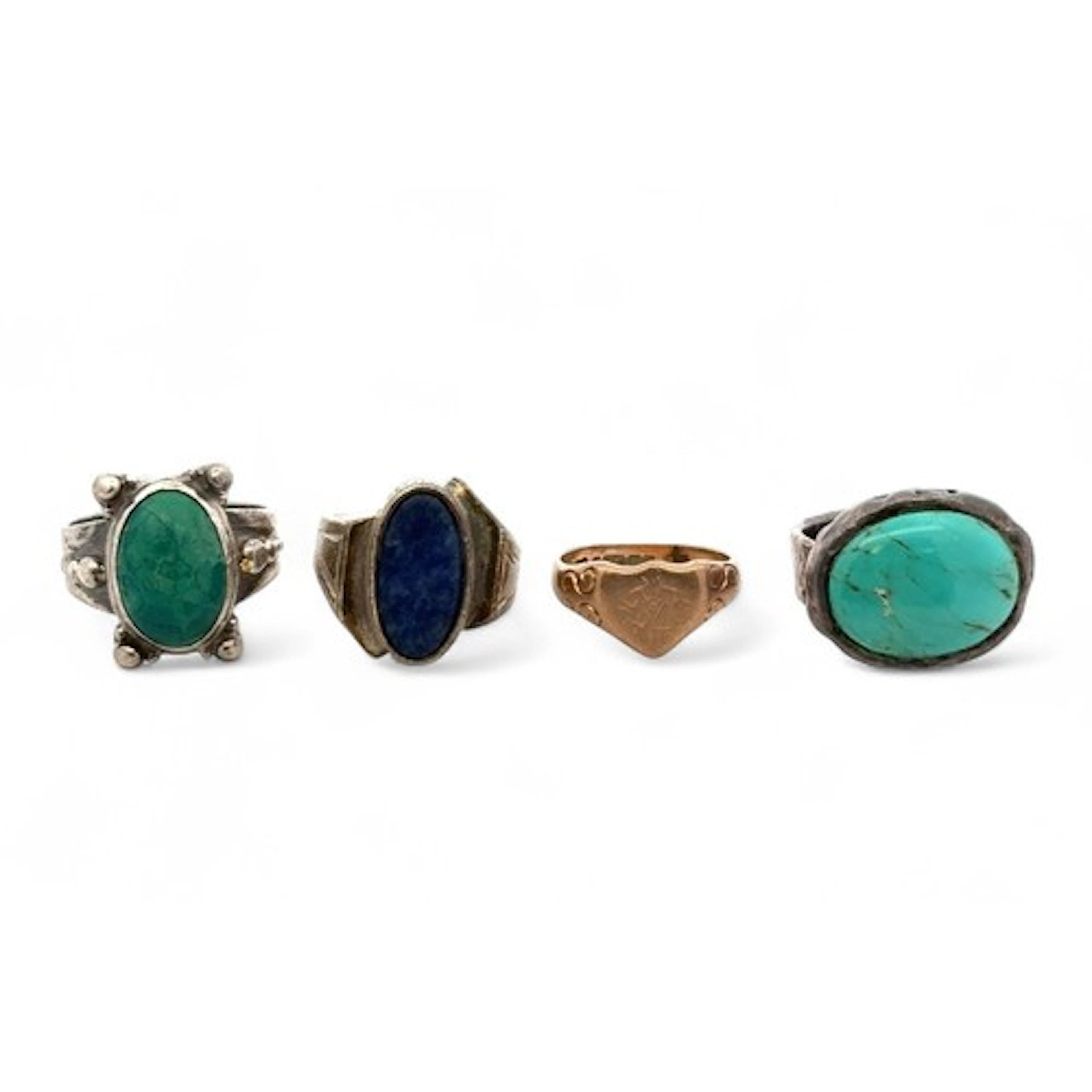Four gold and silver rings. A 9ct gold heart signet ring siz...