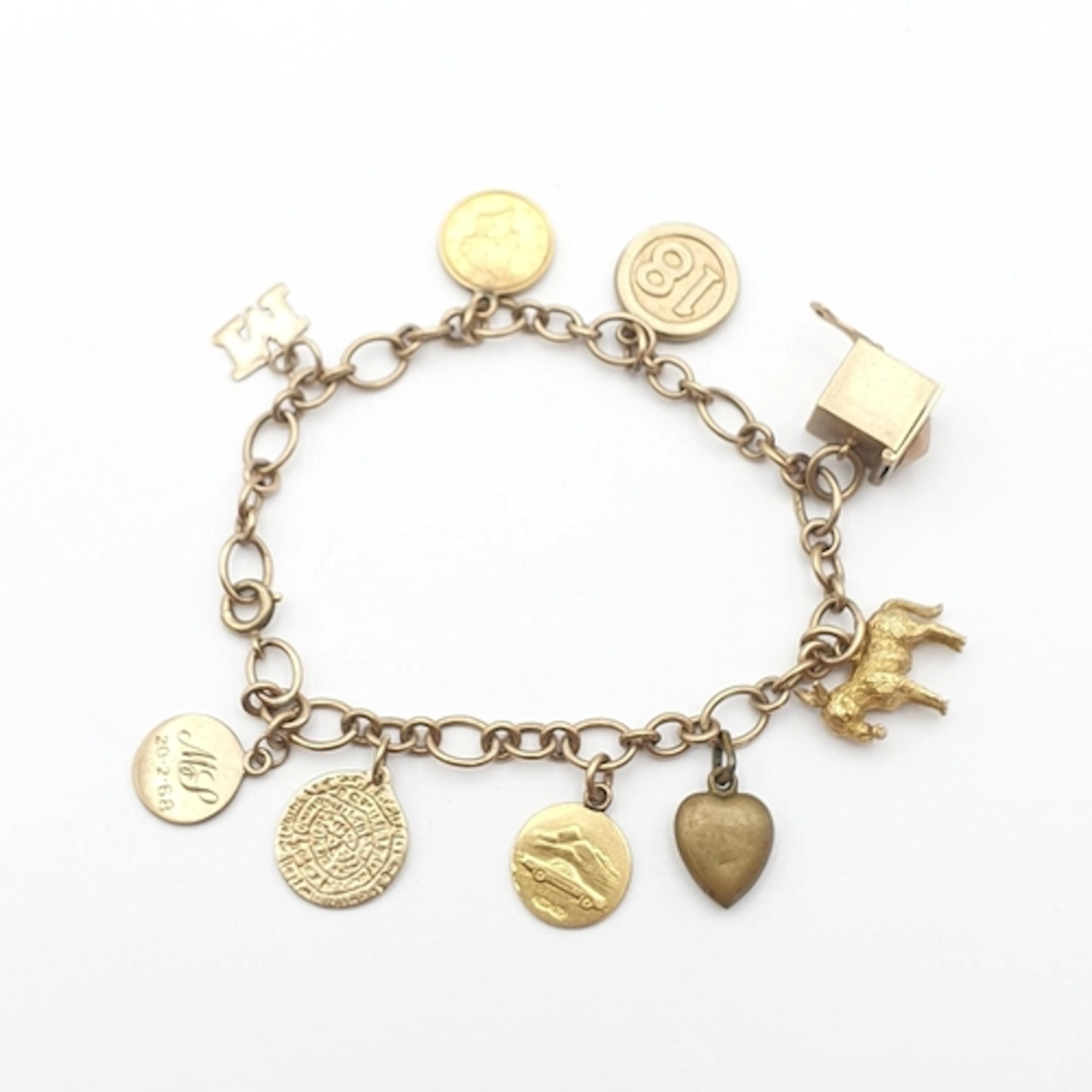 A 9ct gold Charm Bracelet with a number of charms attached i...
