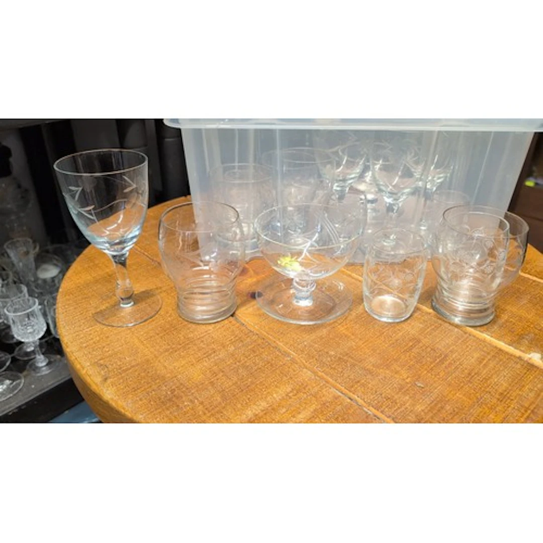 A group of clear glass tableware comprising stemmed glasses,...