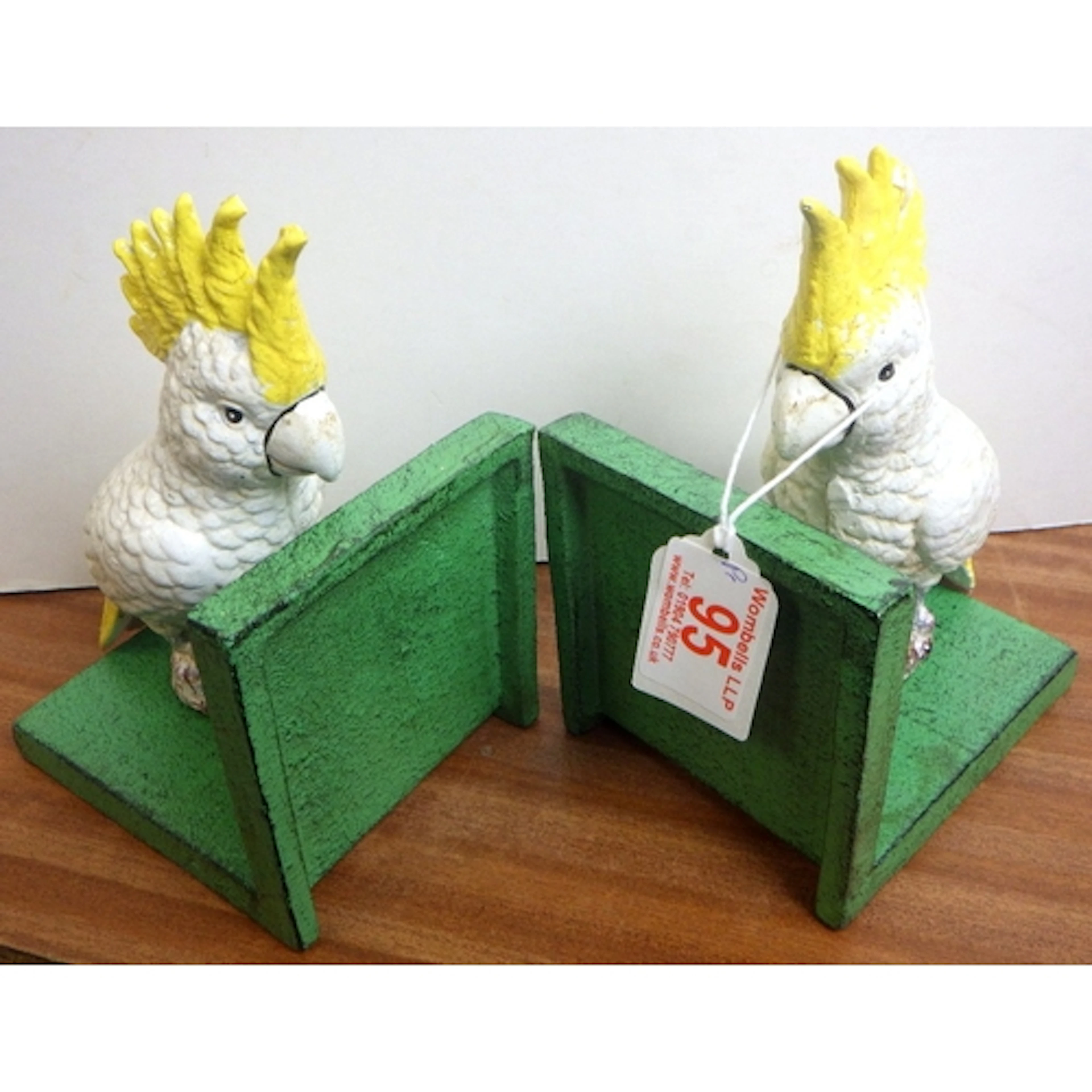 A pair of cast “parrots” bookends