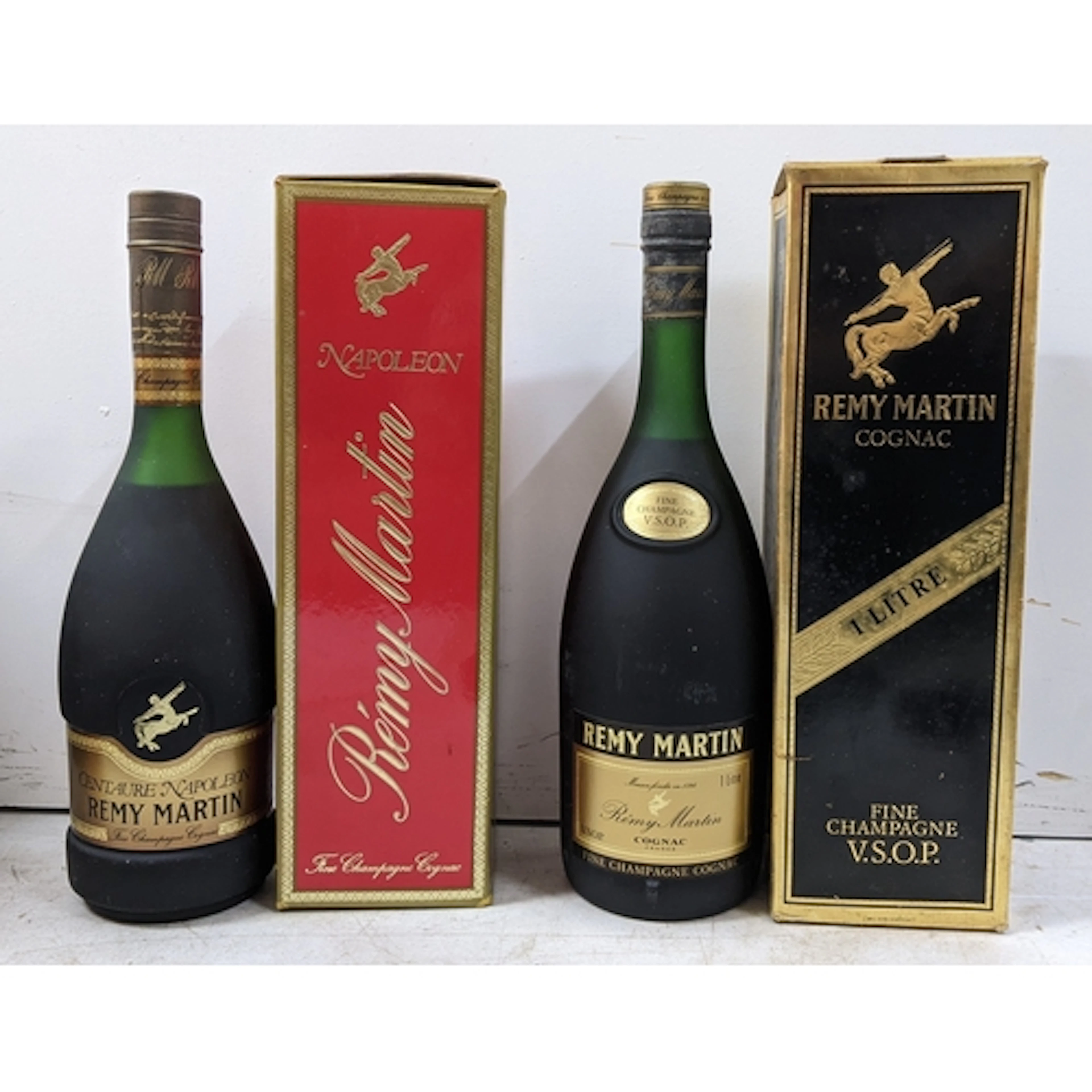 A group of two bottles of Rémy Martin Cognac, comprising: - ...