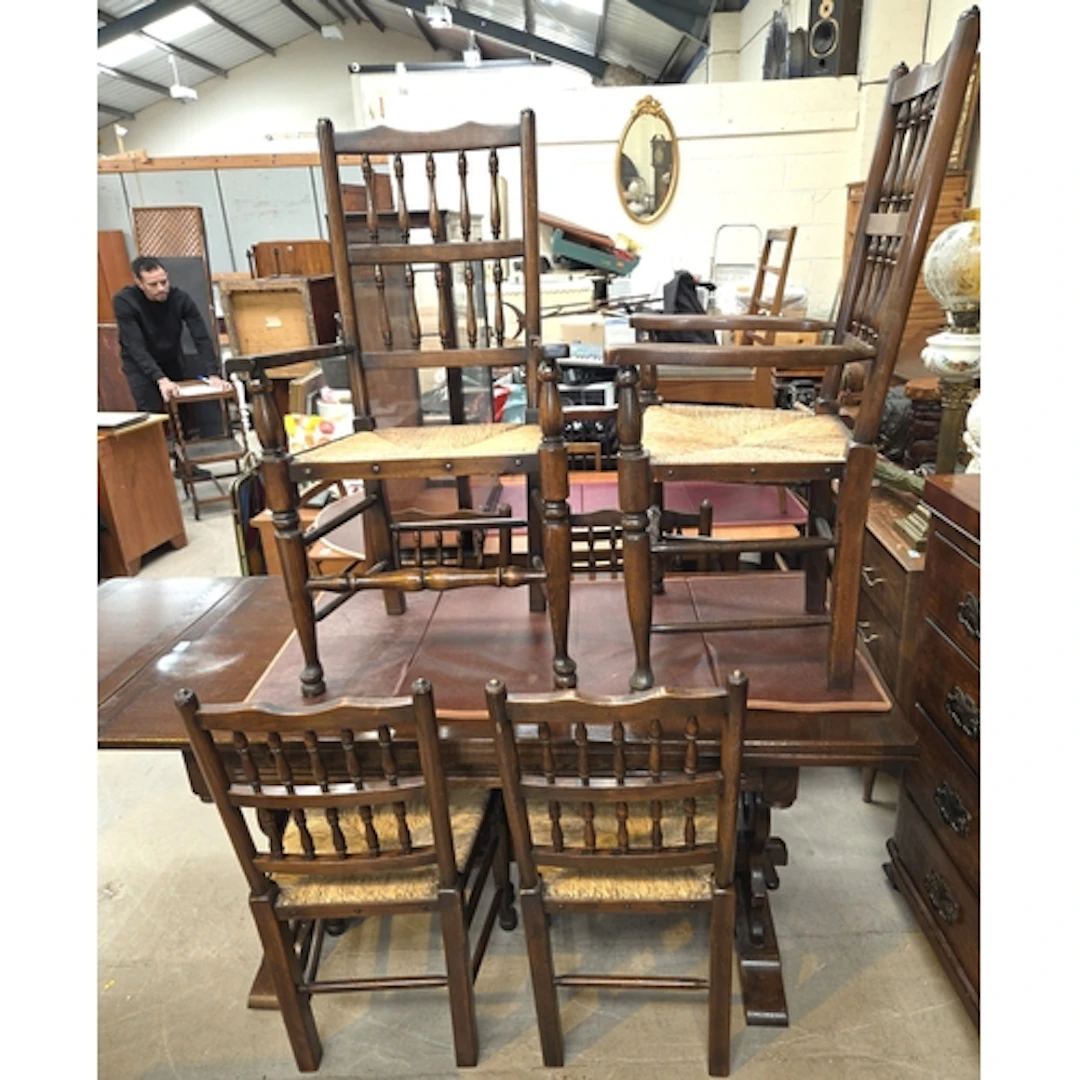 An oak Reprodux draw leaf table with 4 + 2 Lancashire spindl...