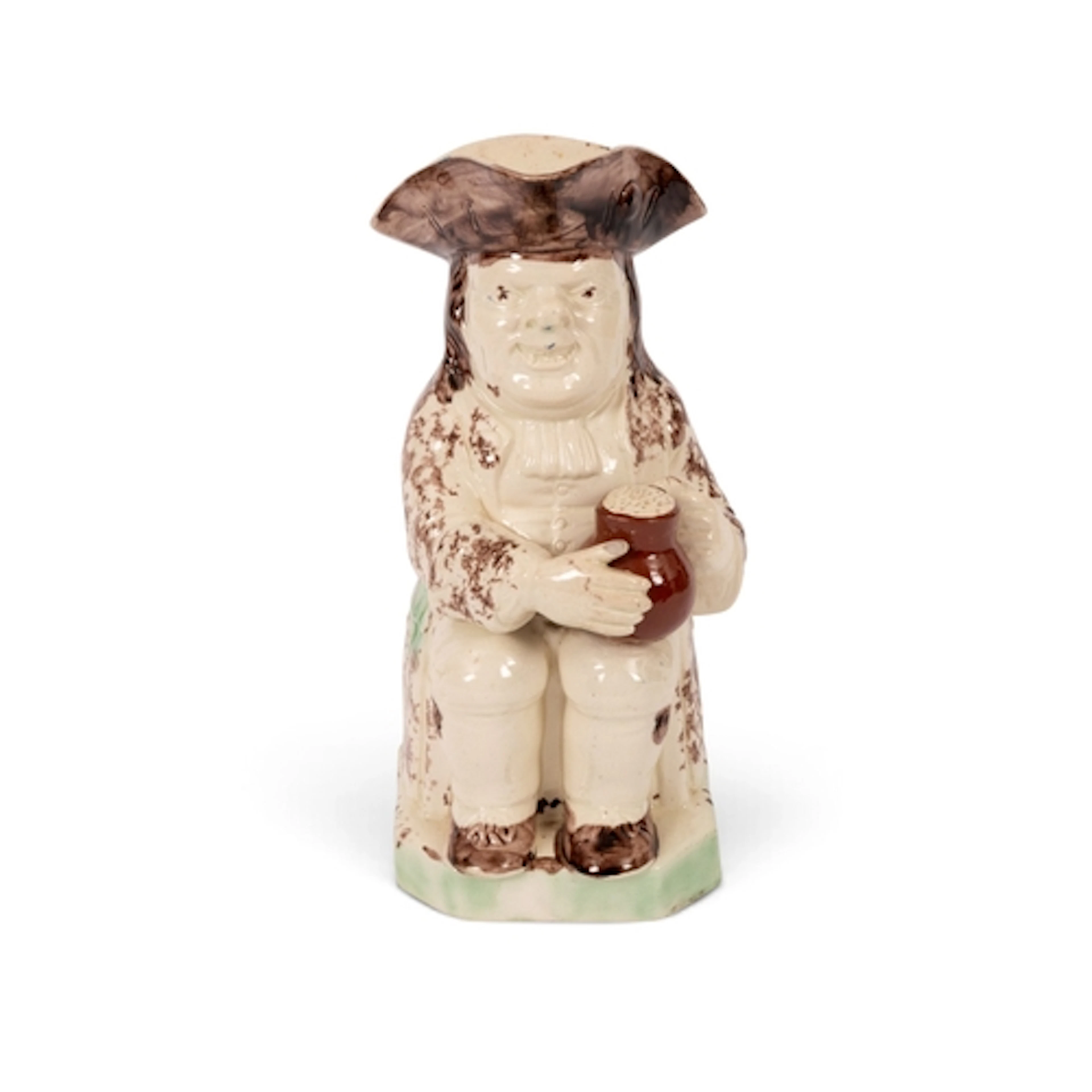 A creamware Toby jug of Ralph Wood type, c.1785-90, seated w...
