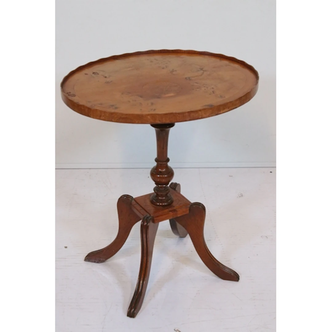 Reproduction yew wood wine table, having shaped oval top on ...