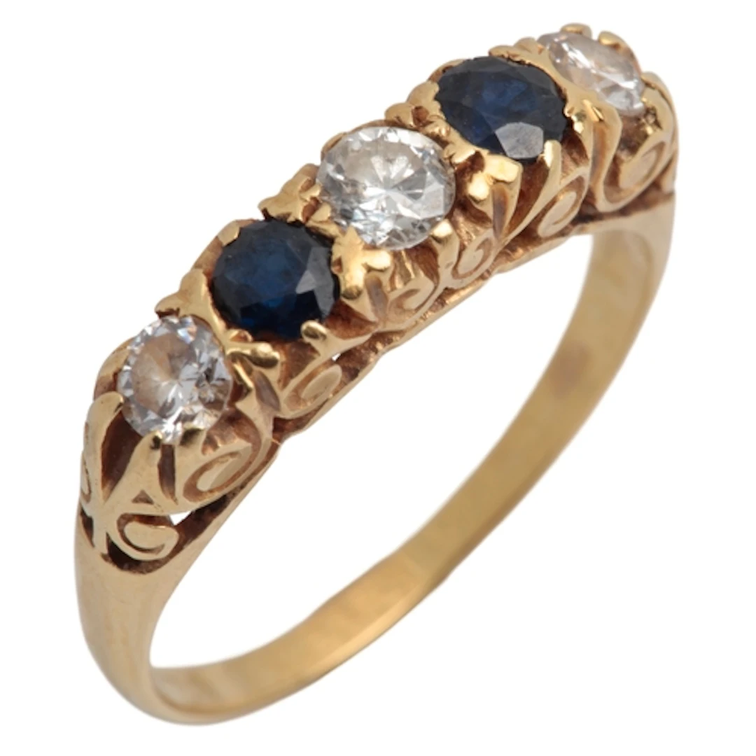 A sapphire and diamond five-stone ring, circa 1980, set with...