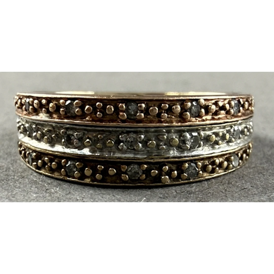 Jewellery: a 9ct gold and diamond ring, three bands of diffe...