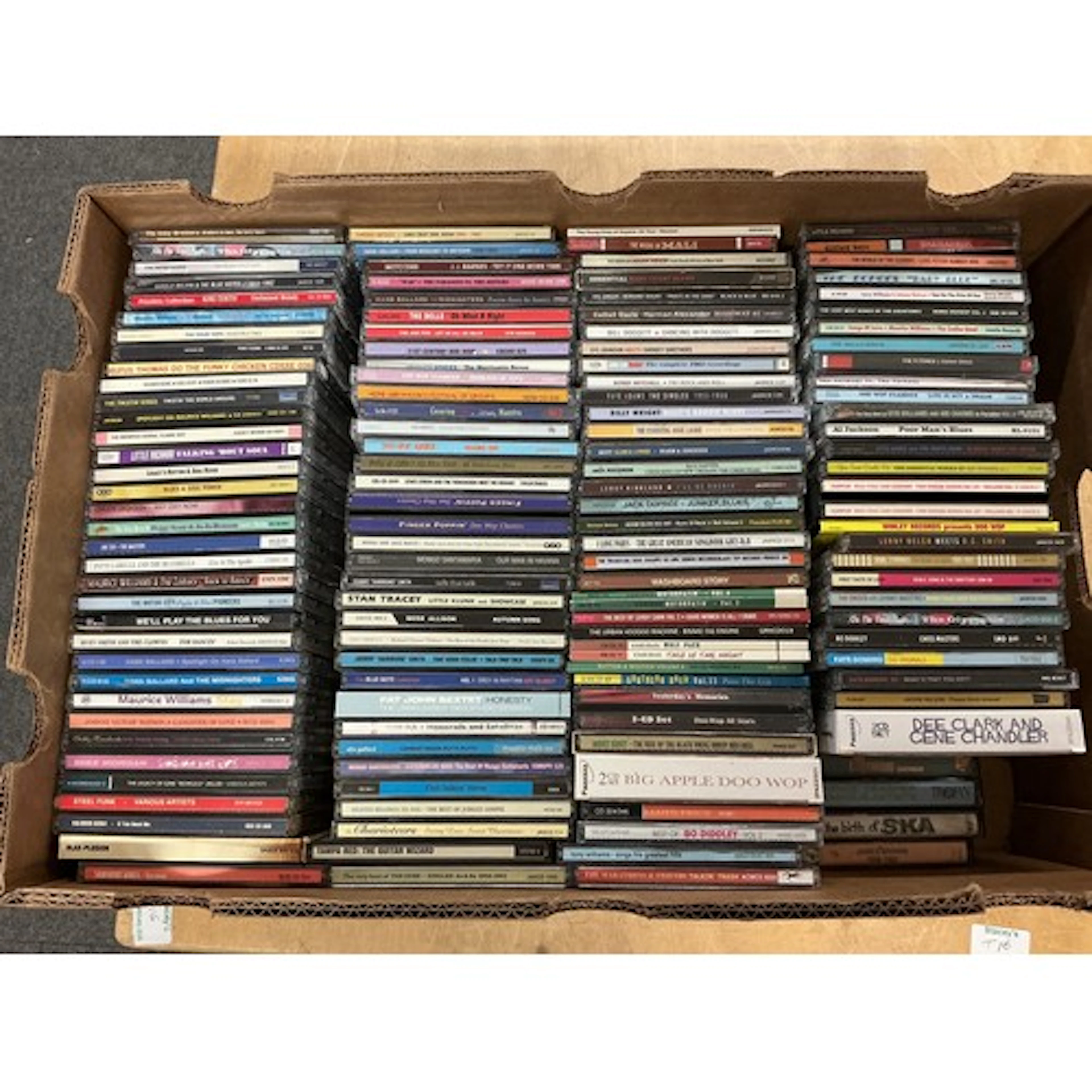 A box of soul, doo wop and jazz CDs and cassettes.