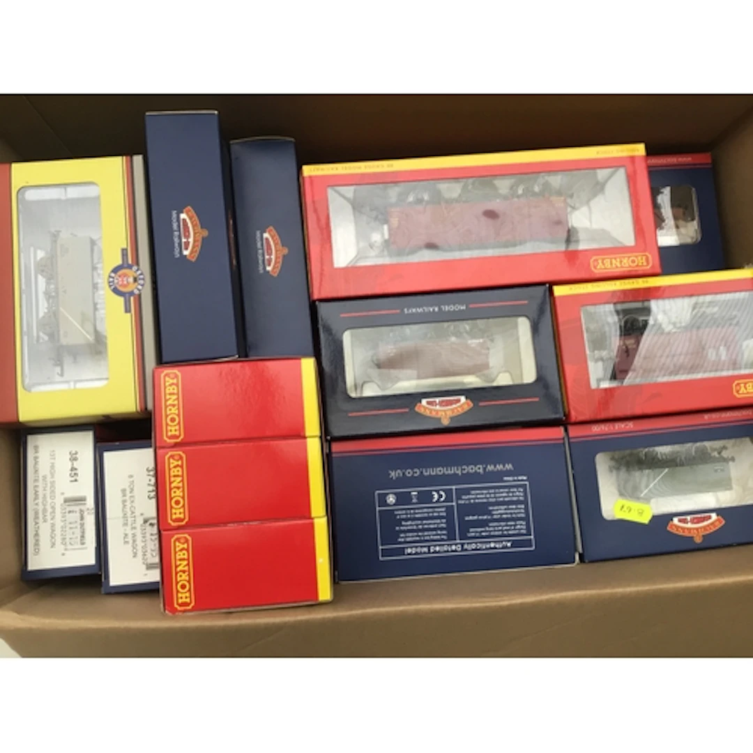 A collection of boxed 00 gauge model railway wagons an...