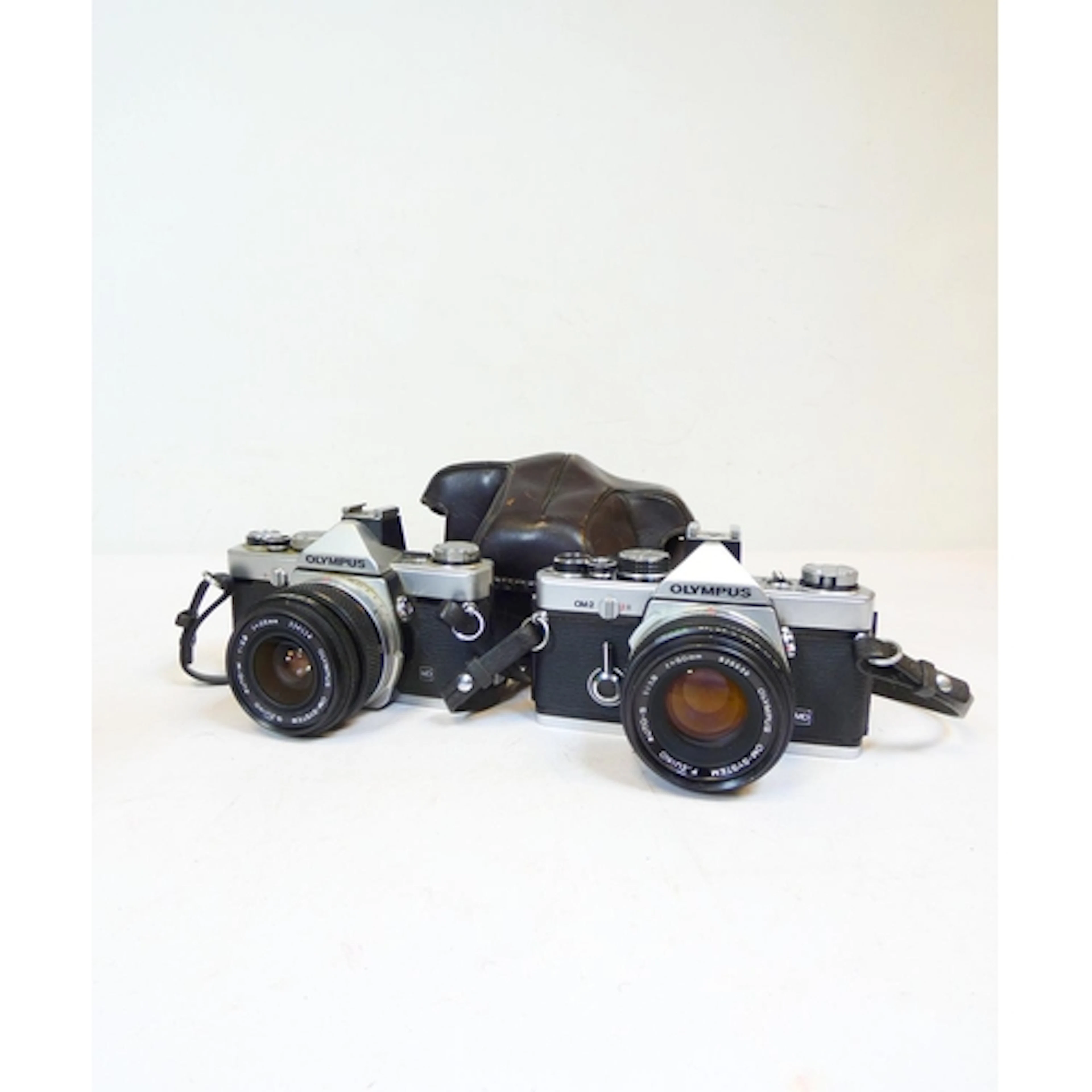 Olympus. An Olympus OM-1 35mm SLR camera fitted with an OM Z...