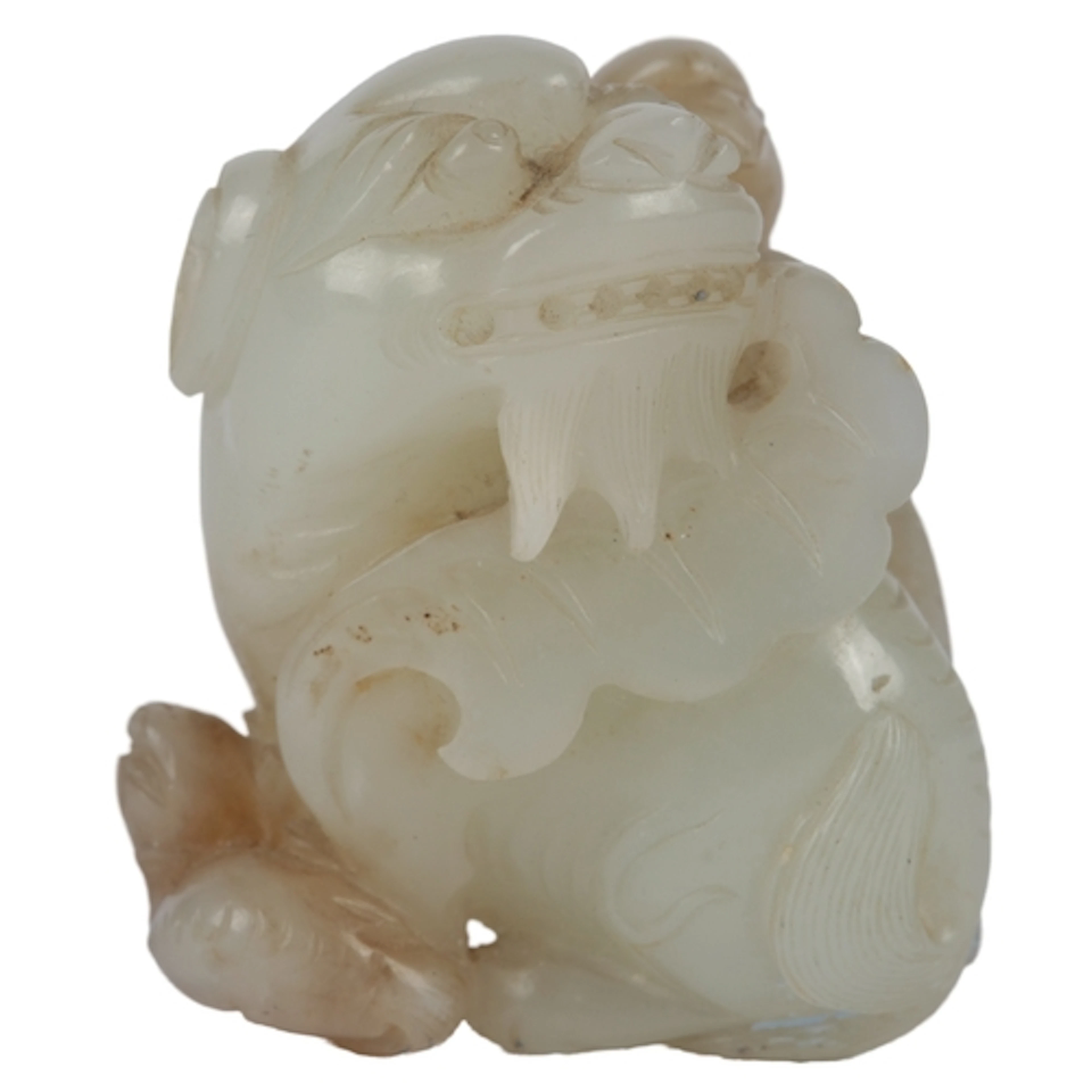 A Chinese pale celadon jade group of a winged lion (pixiu), ...