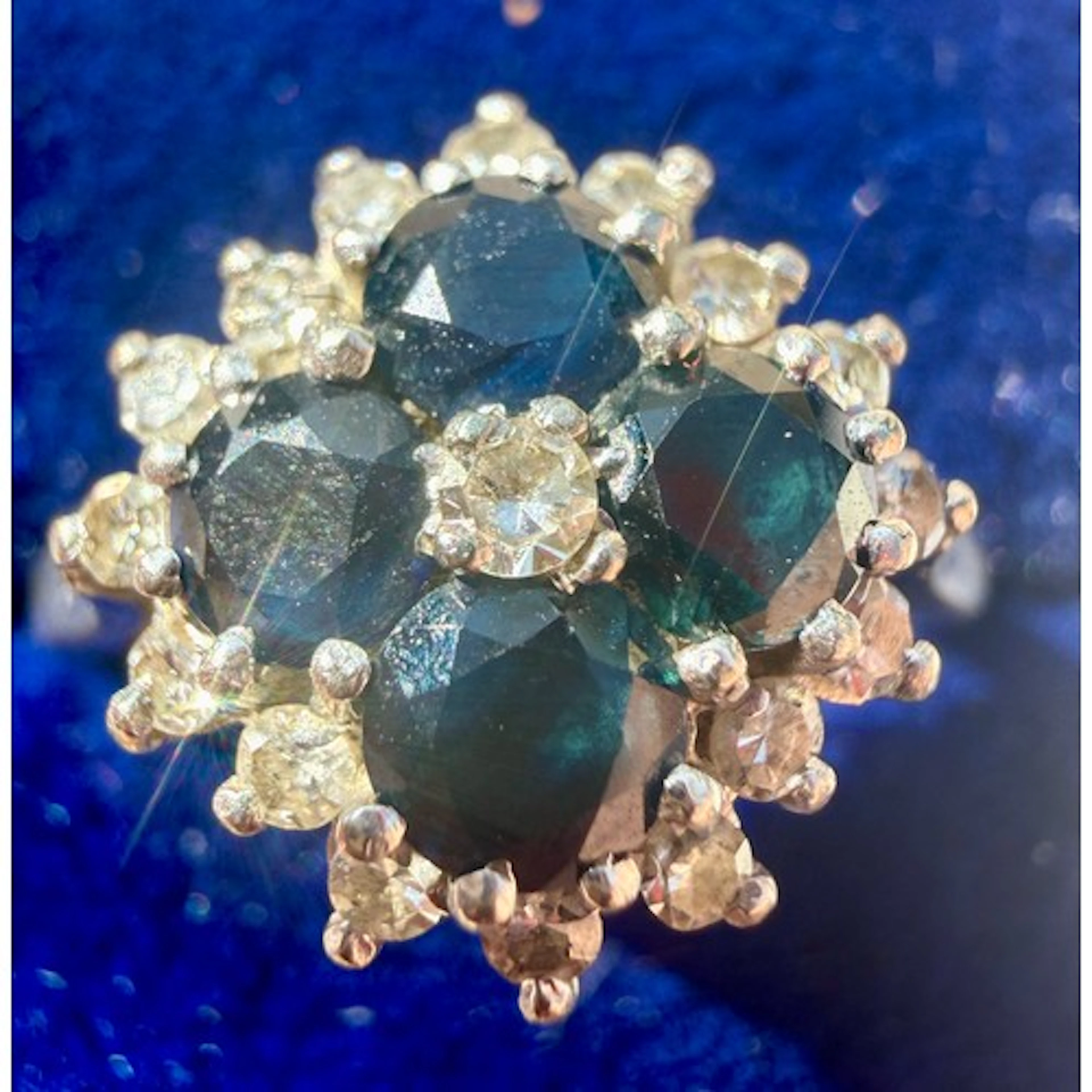 An 18 carat sapphire and diamond cluster ring set in 18 cara...