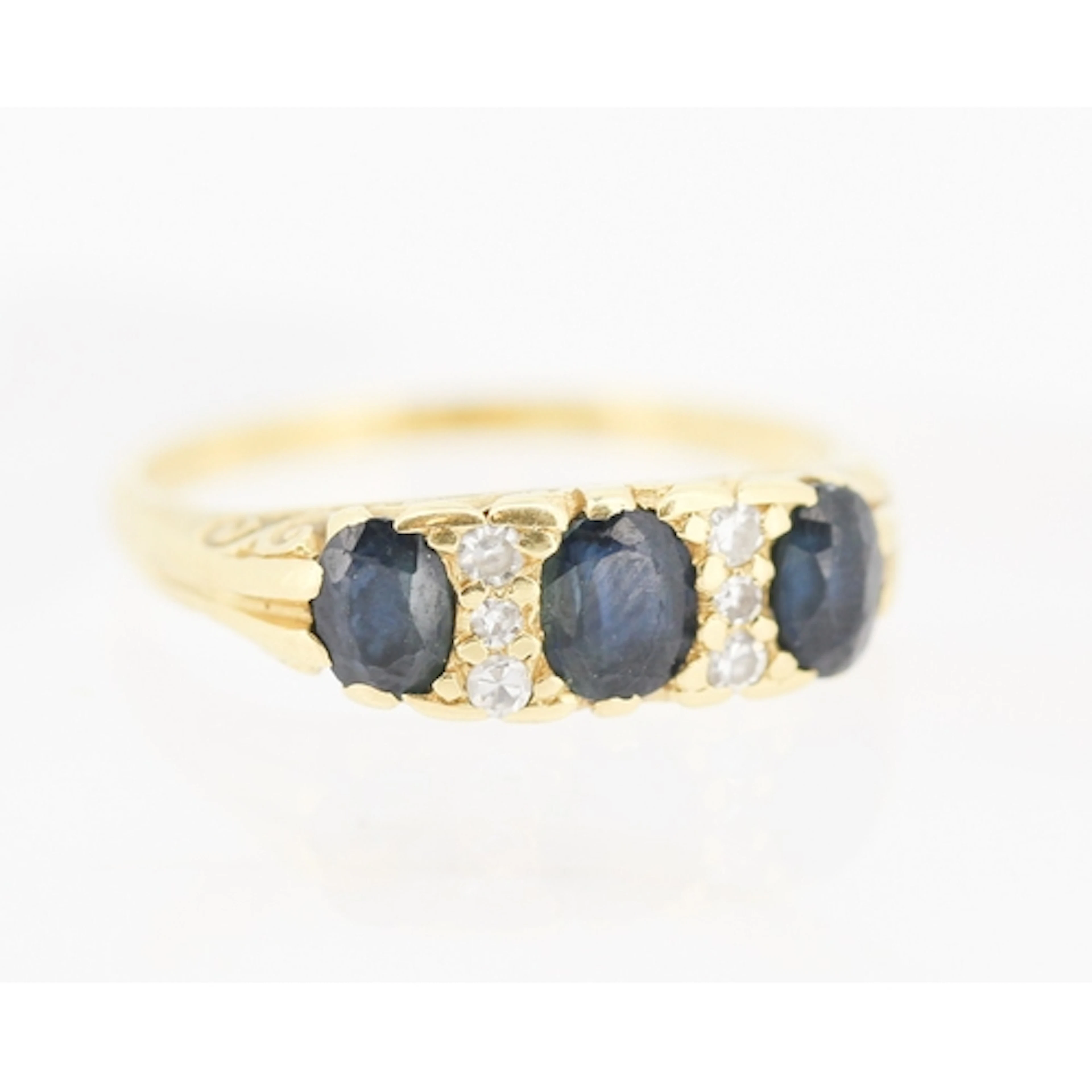 Sapphire Three Stone Ring with Six Diamond Inset Mounted in ...
