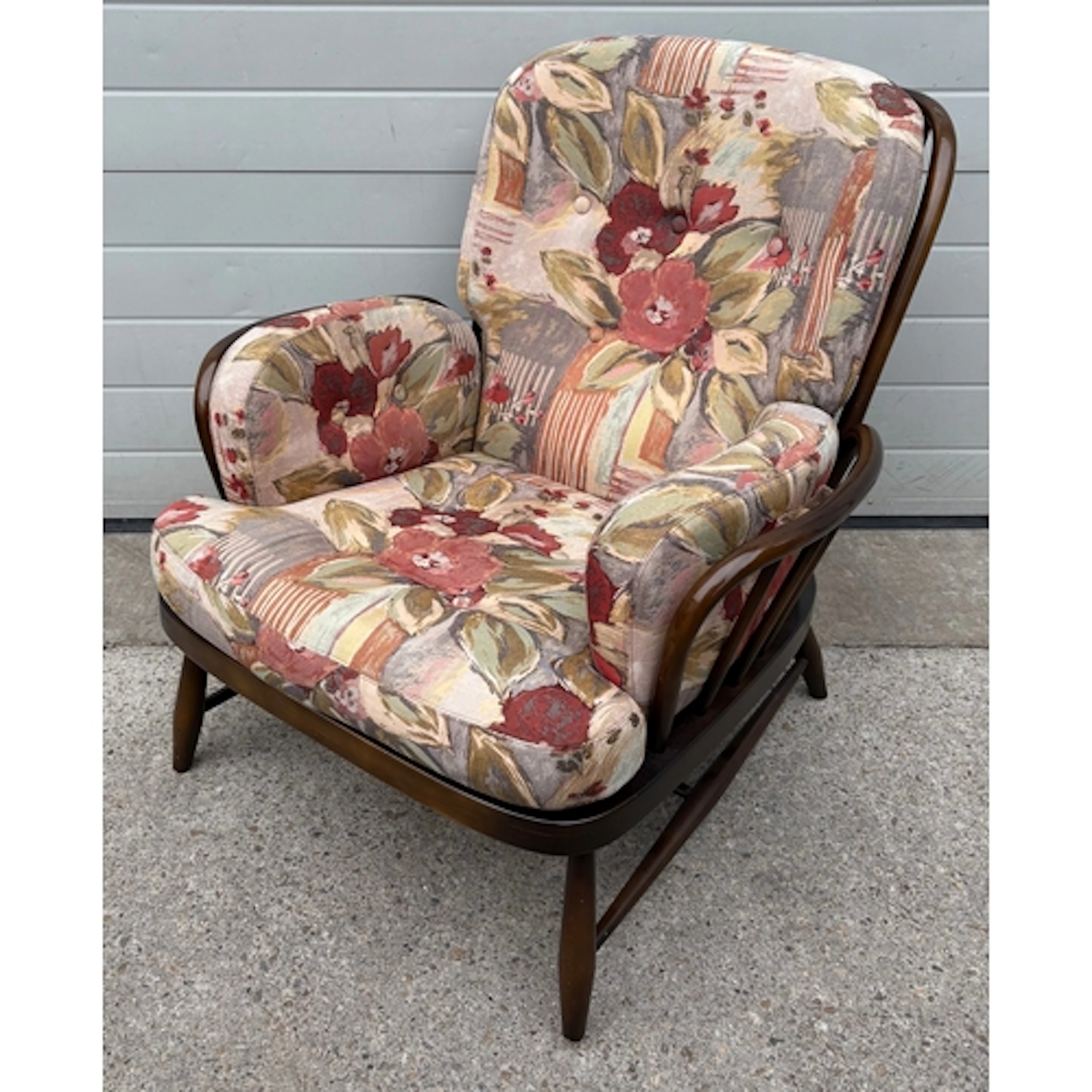 A dark Ercol armchair