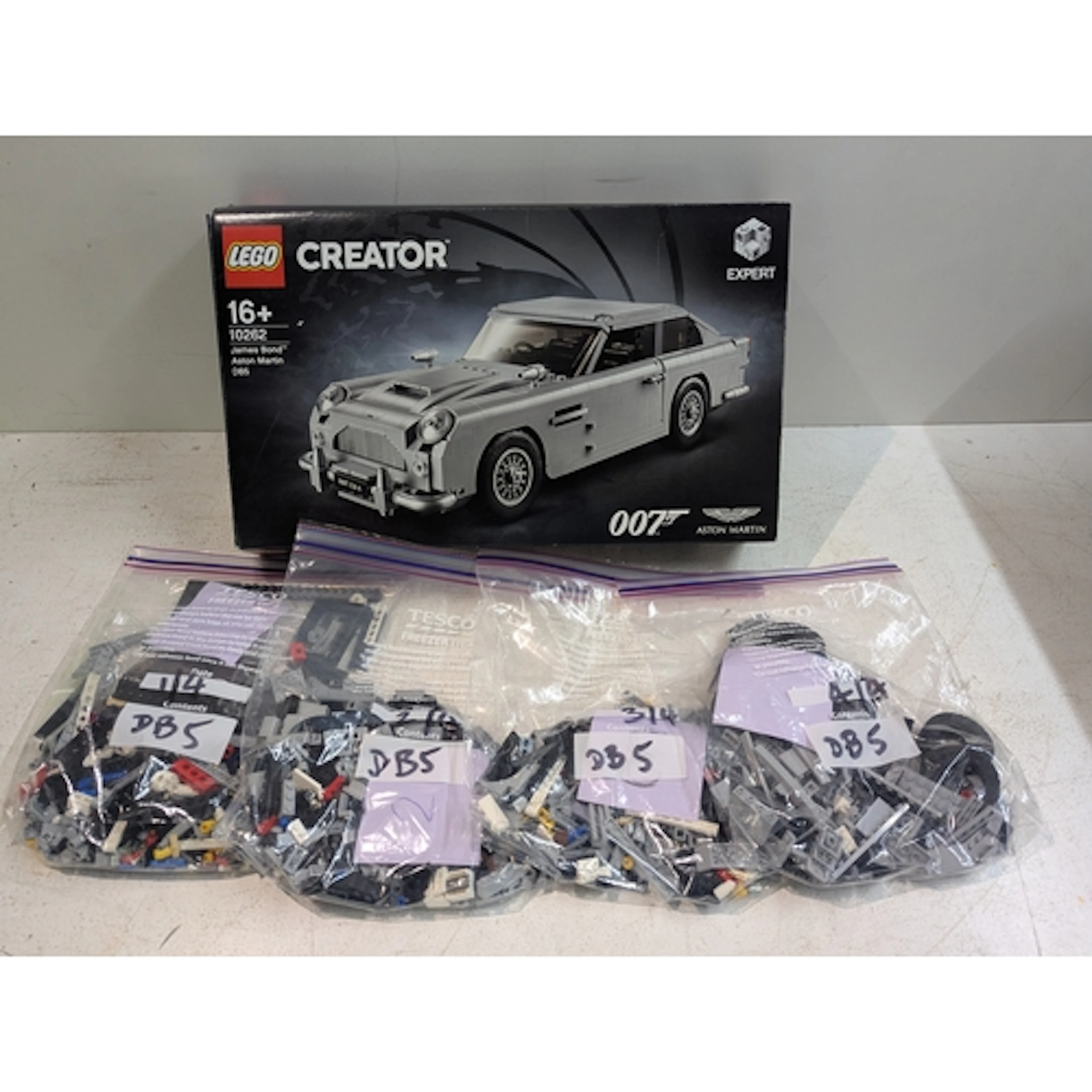 A Lego set, not in original packaging but has original box, ...