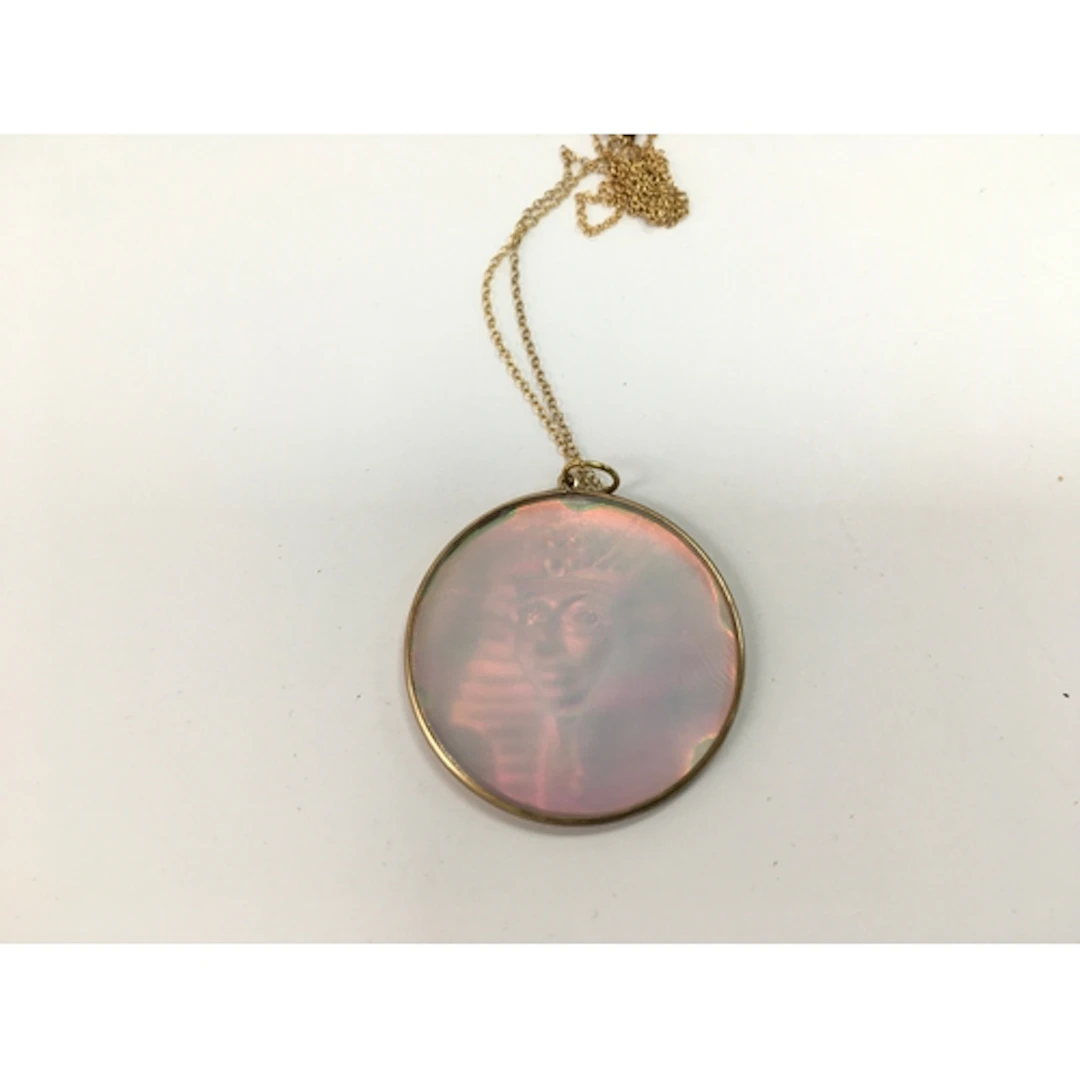 A 9ct gold hologram pendant on 9ct chain.