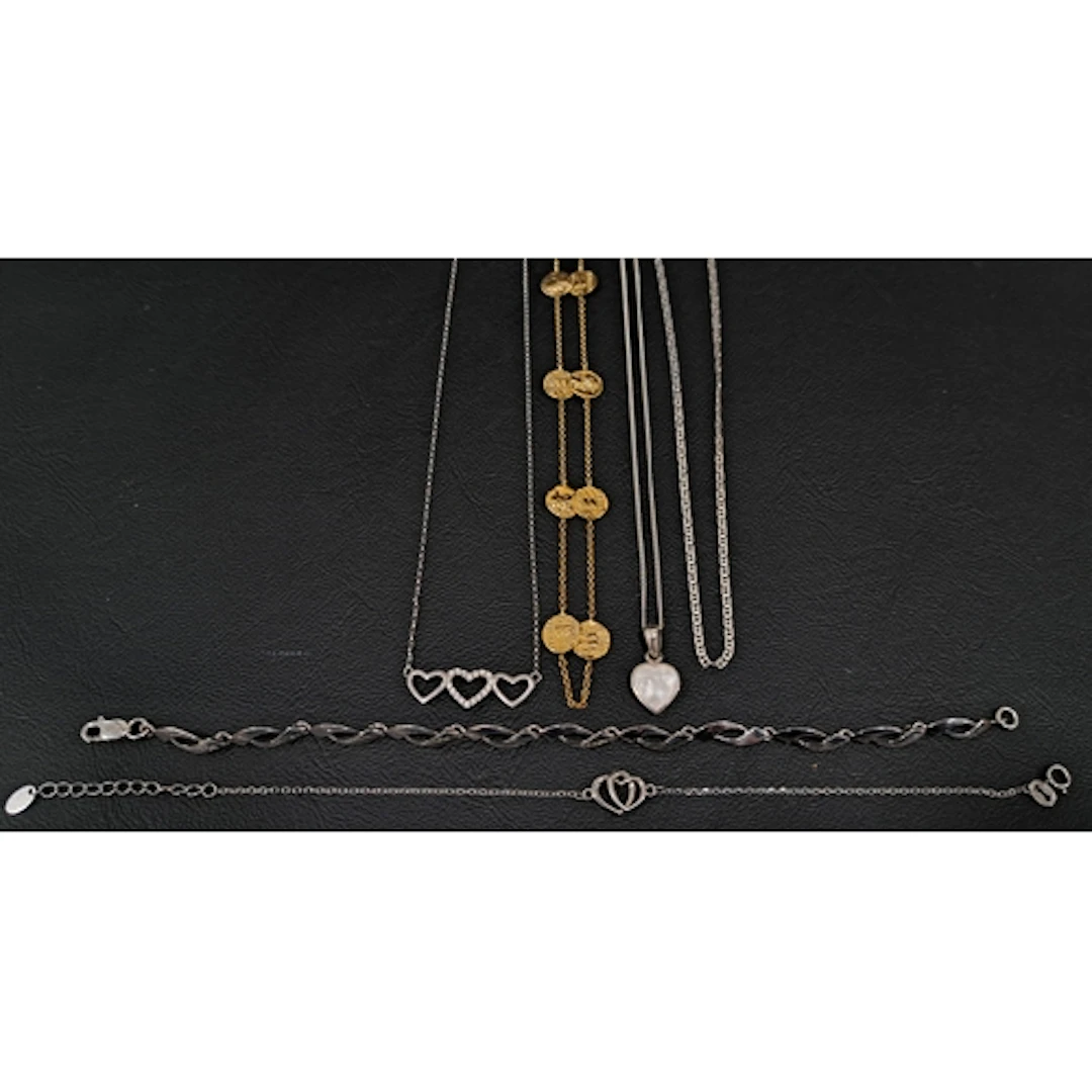 SELECTION OF SILVER JEWELLERY comprising a triple heart pend...