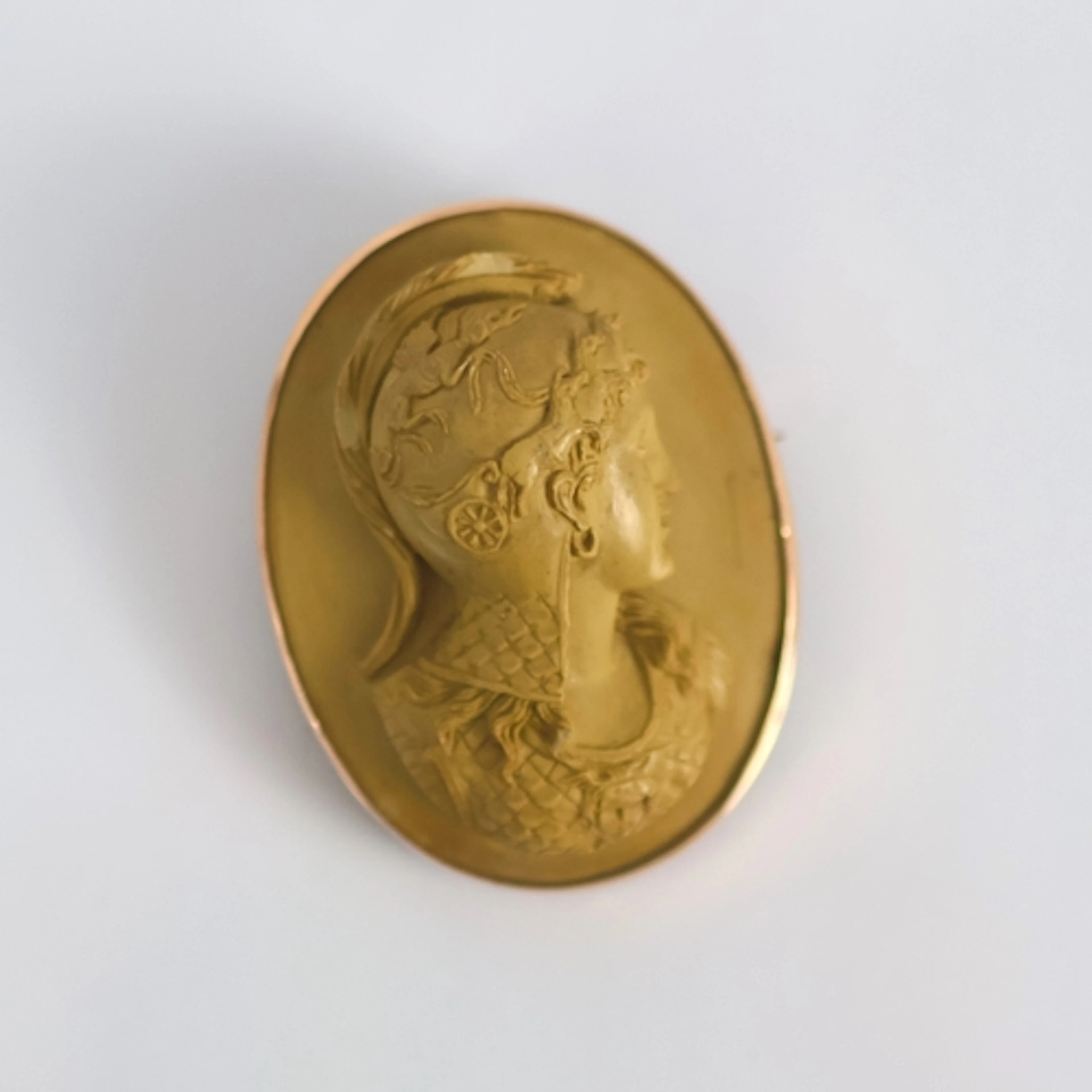 A late 19th century lava cameo, the oval depiction of Athena...