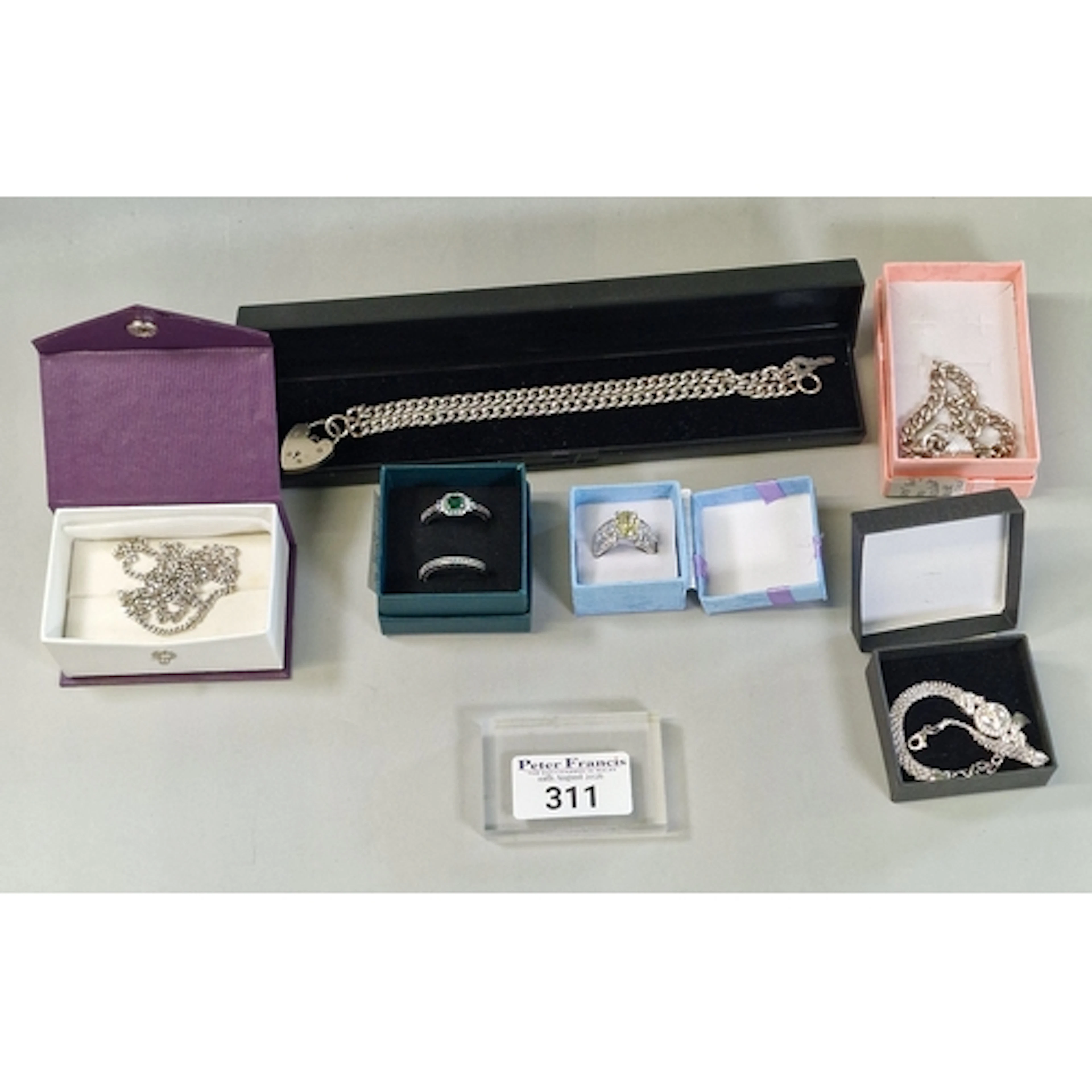 Collection of silver jewellery to include: double curb brace...
