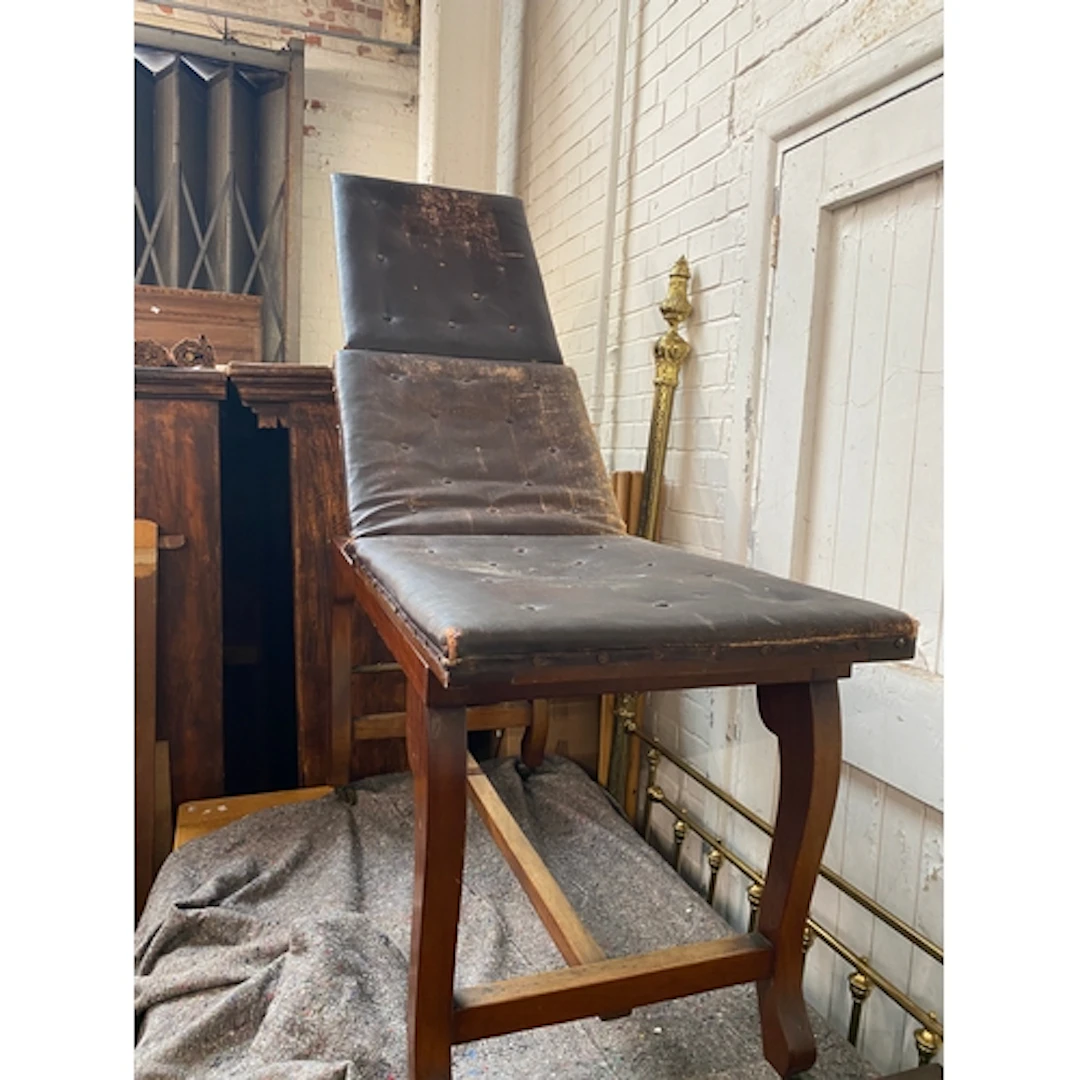 A reclining antique mahogany therapist couch/massage table, ...