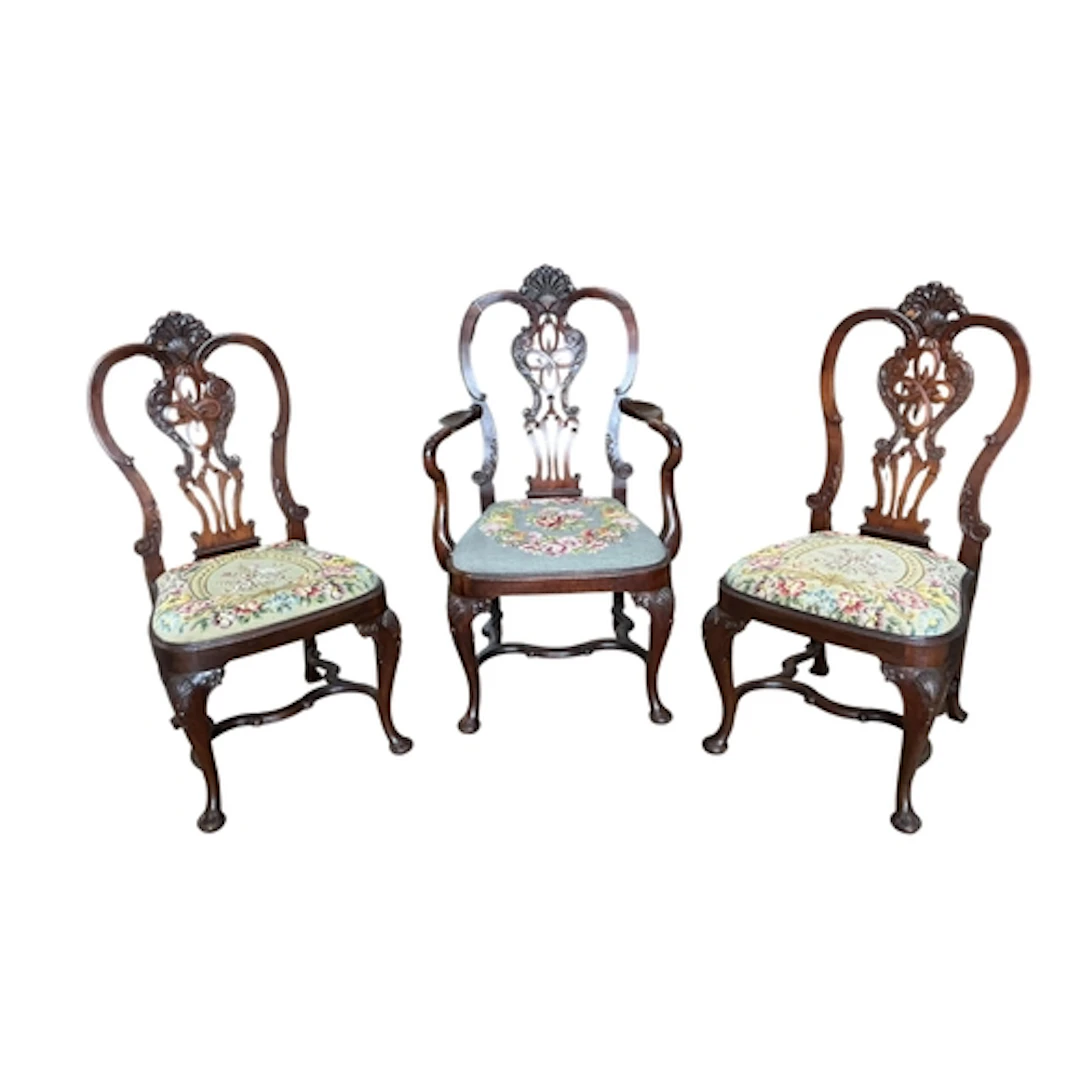 A set of six Chippendale revival mahogany dining chairs, one...