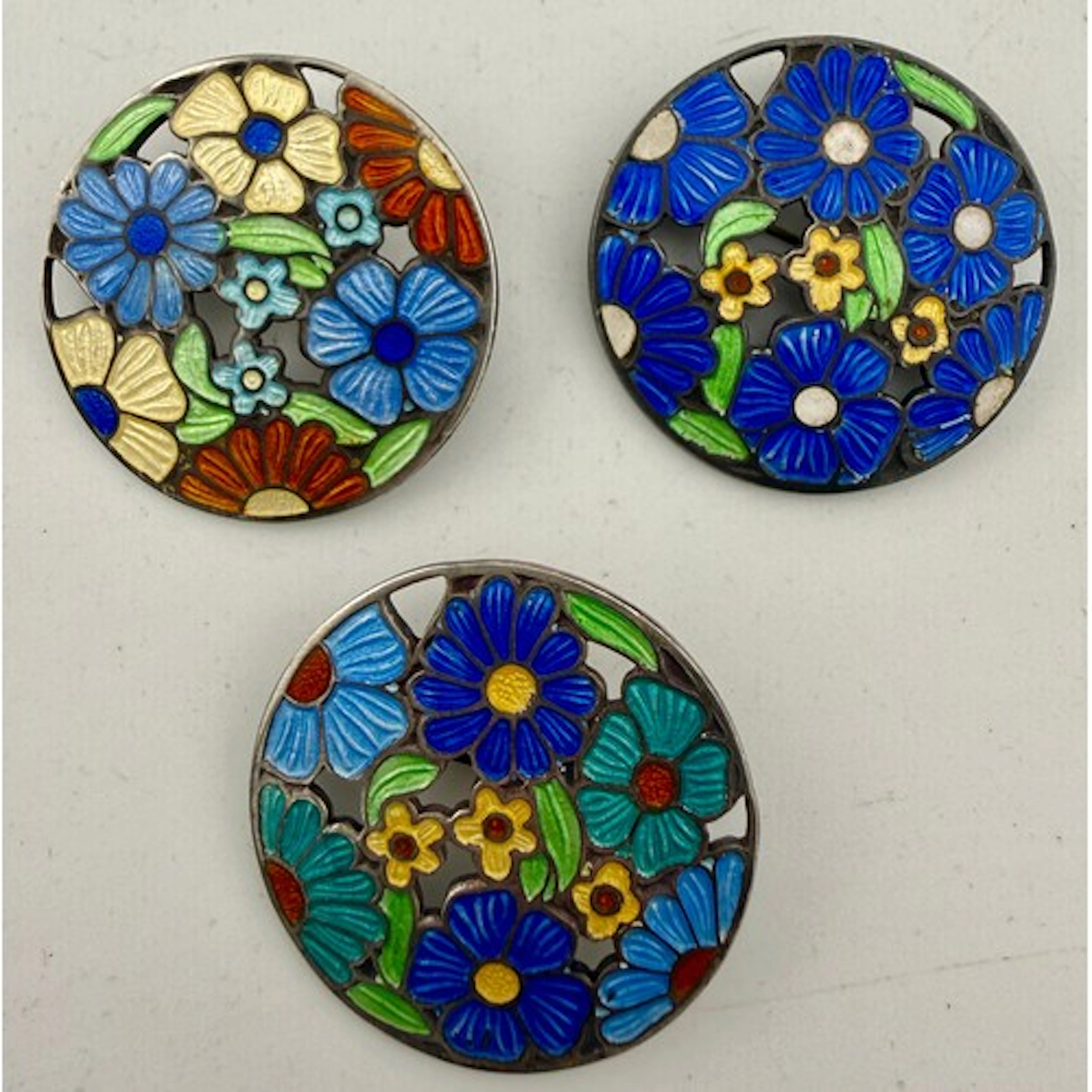 Three silver and enamel brooches, Birmingham 1943 and 1946, ...