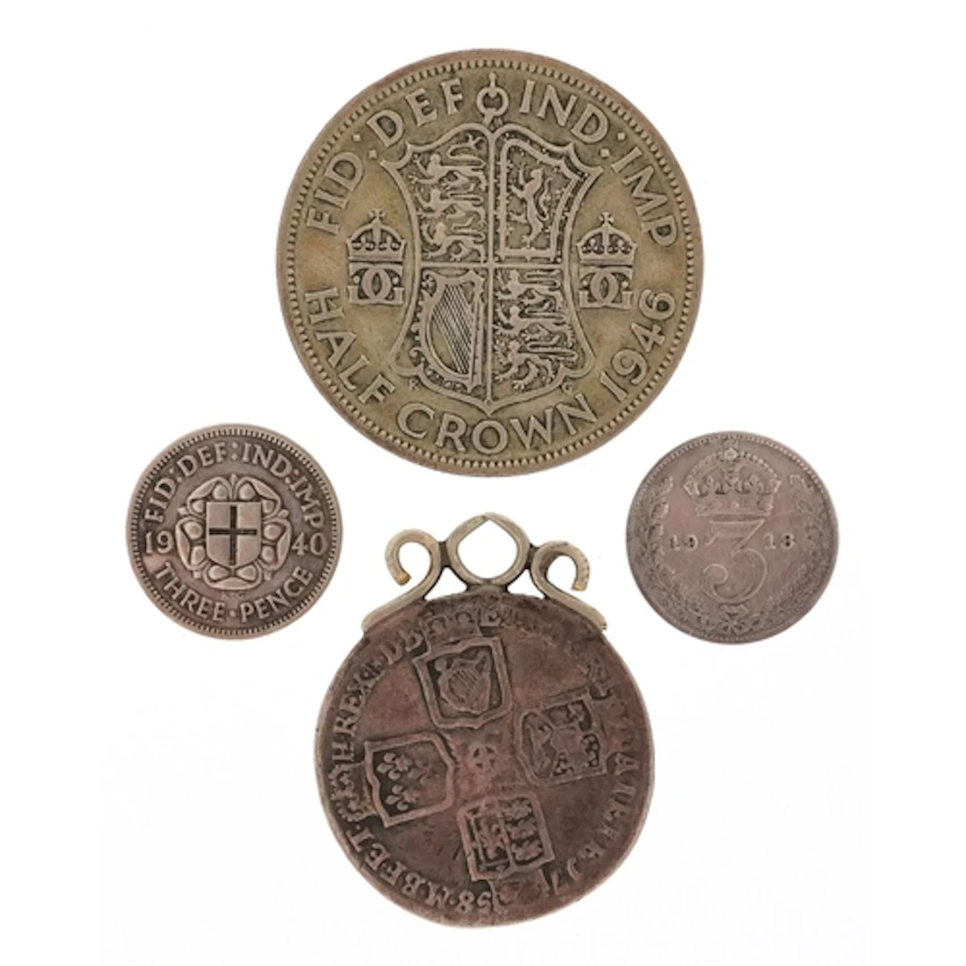 Four British silver coins comprising 1946 half crown, 1940 t...