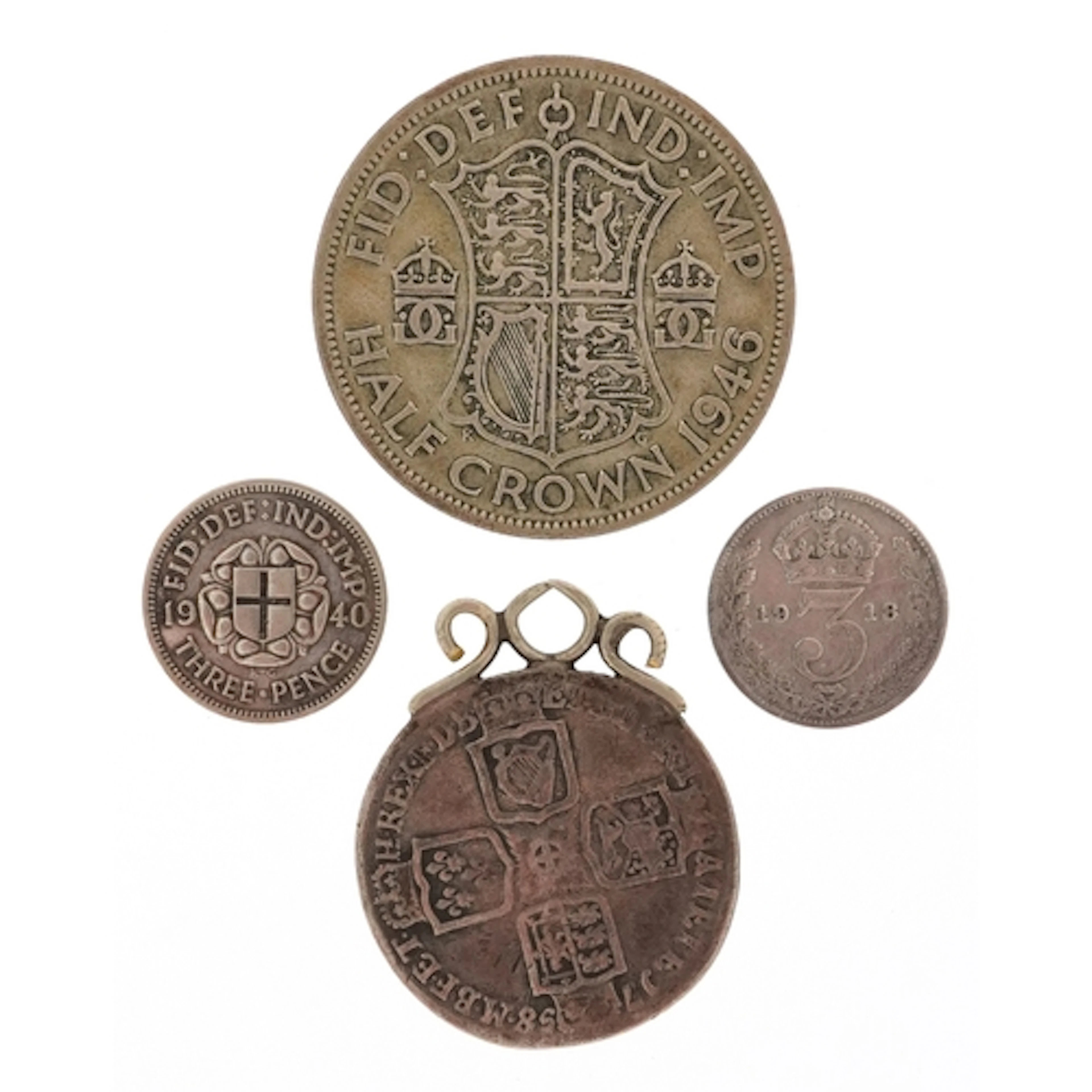 Four British silver coins comprising 1946 half crown, 1940 t...