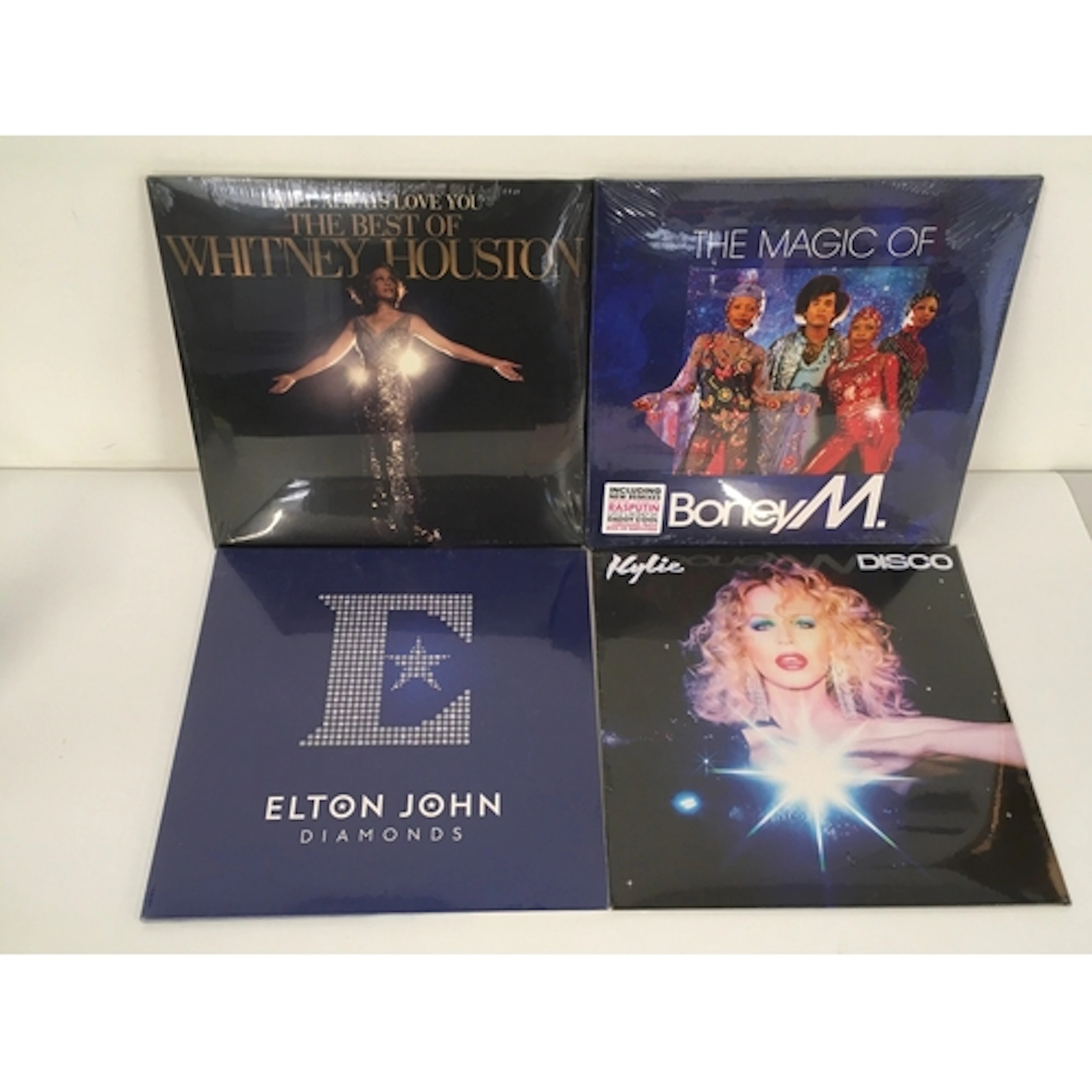Four sealed 180g LPs by Elton John, Whitney Houston, Kylie M...