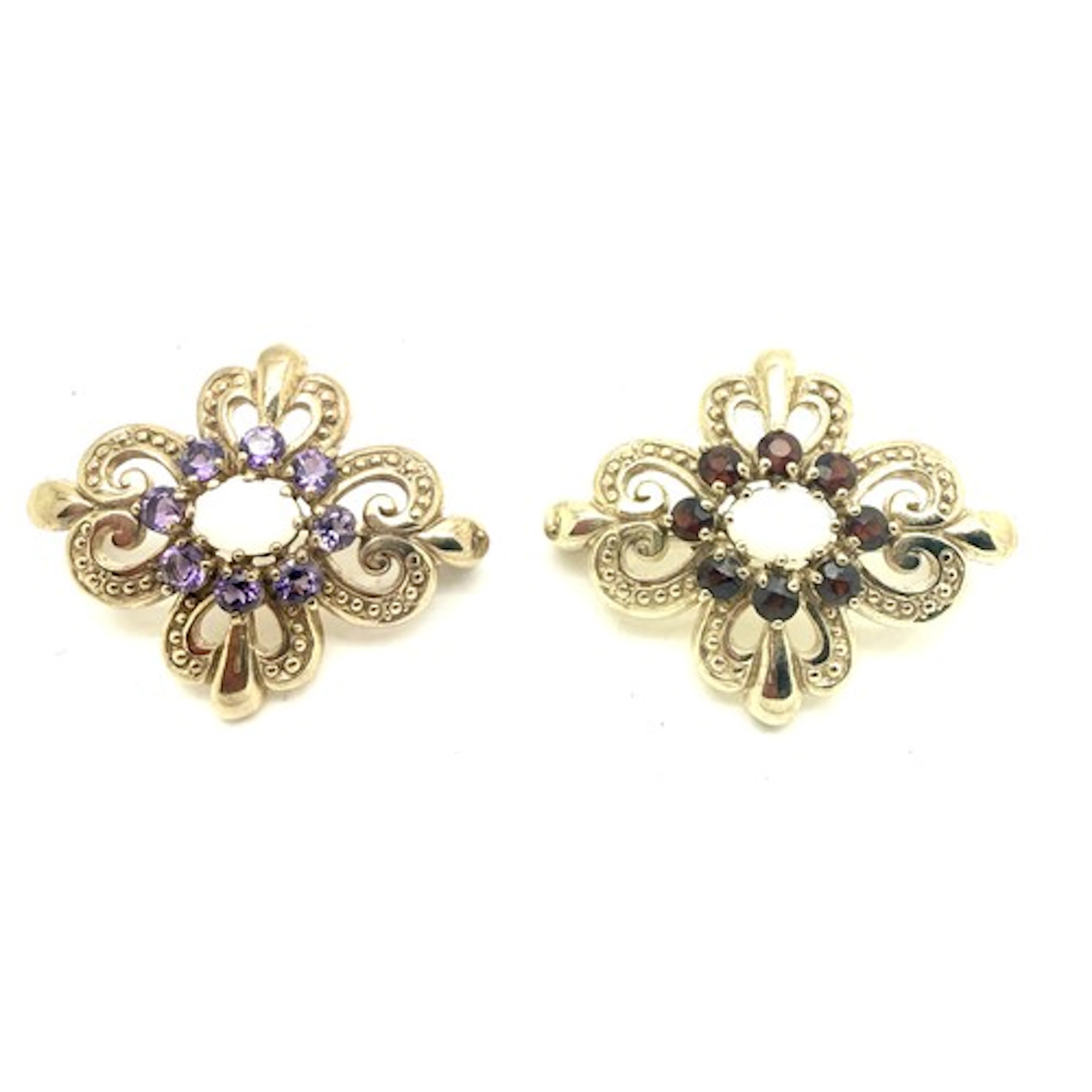 Two 9 carat gold brooches set with opals, garnets and amethy...