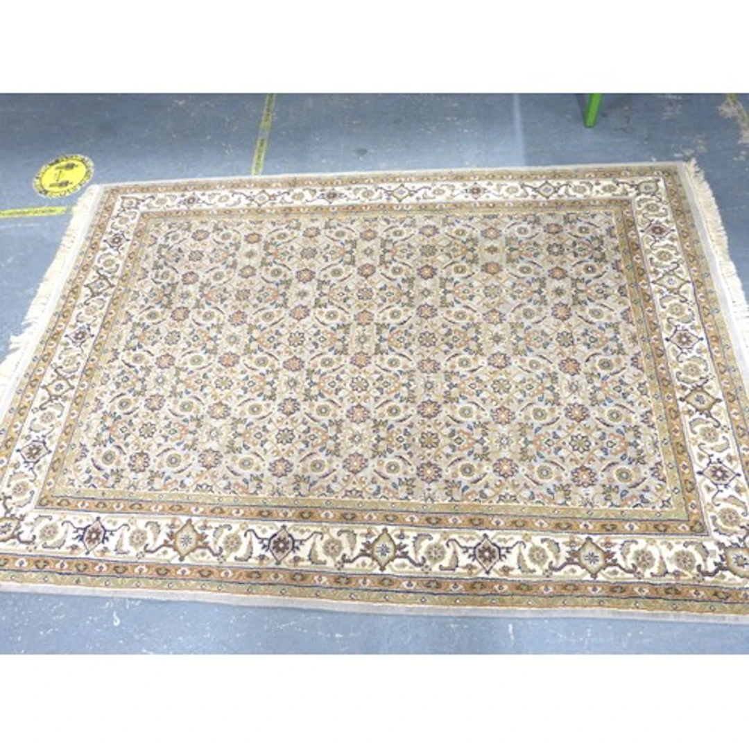 Vintage cream and brown rug.