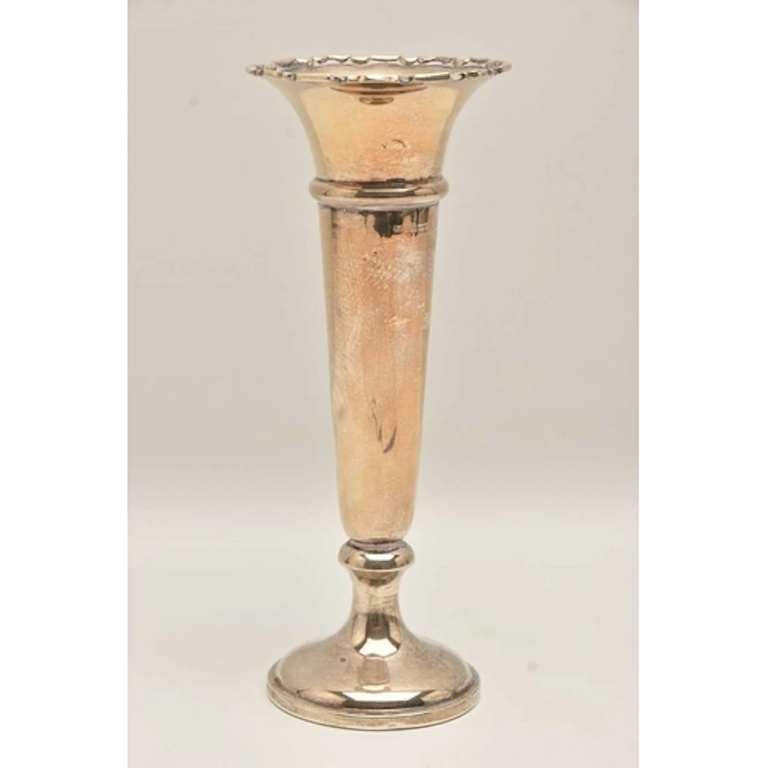A GEORGE V SILVER VASE, polished tapering form with wavy rim...