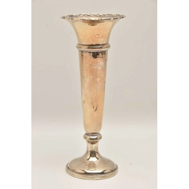 A GEORGE V SILVER VASE, polished tapering form with wavy rim...