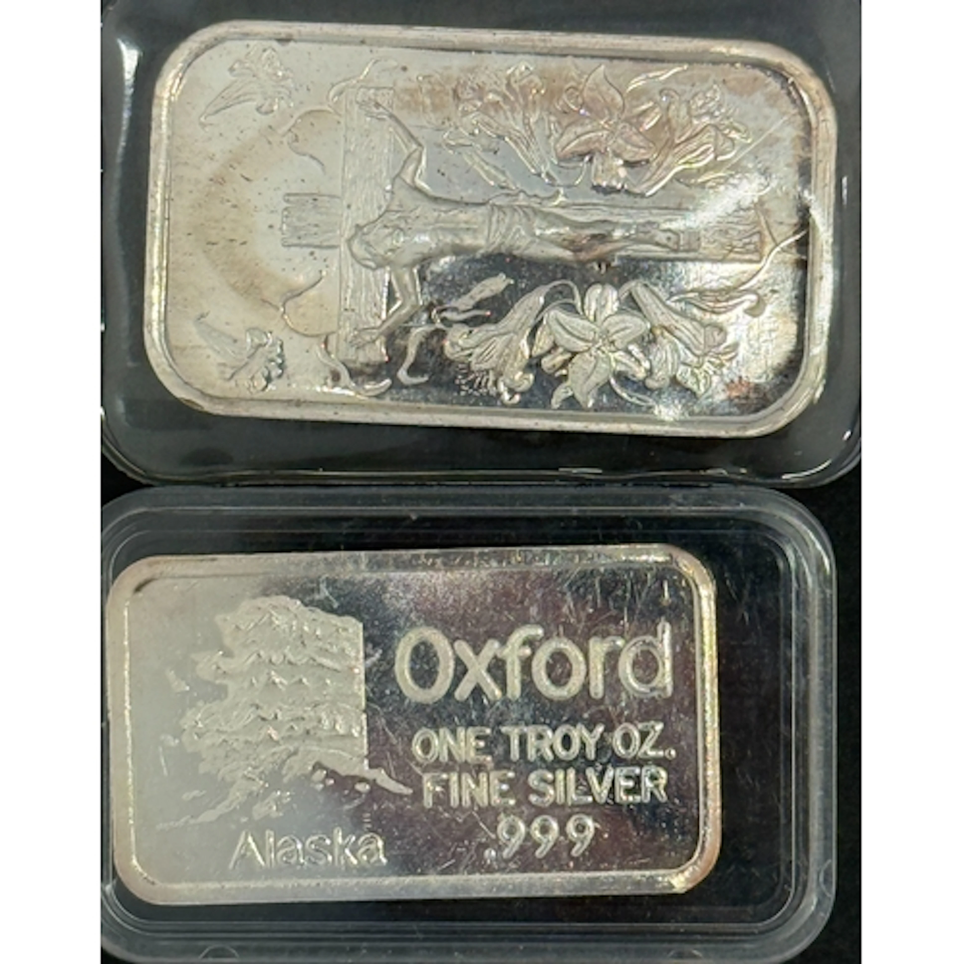 A pair of 1oz .999 fine silver ingots comprising an Oxford b...