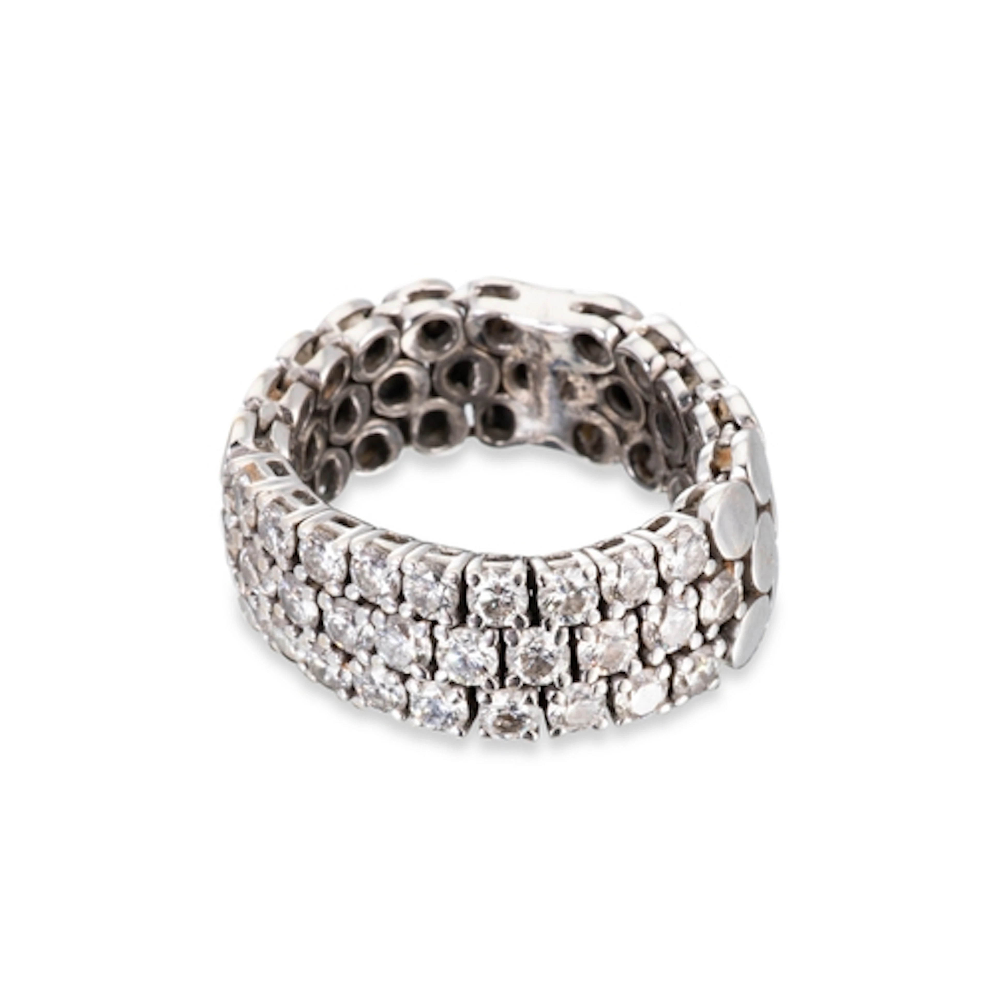 A DIAMOND SET FLEXIBLE BAND RING, XRF testing as 18ct white ...