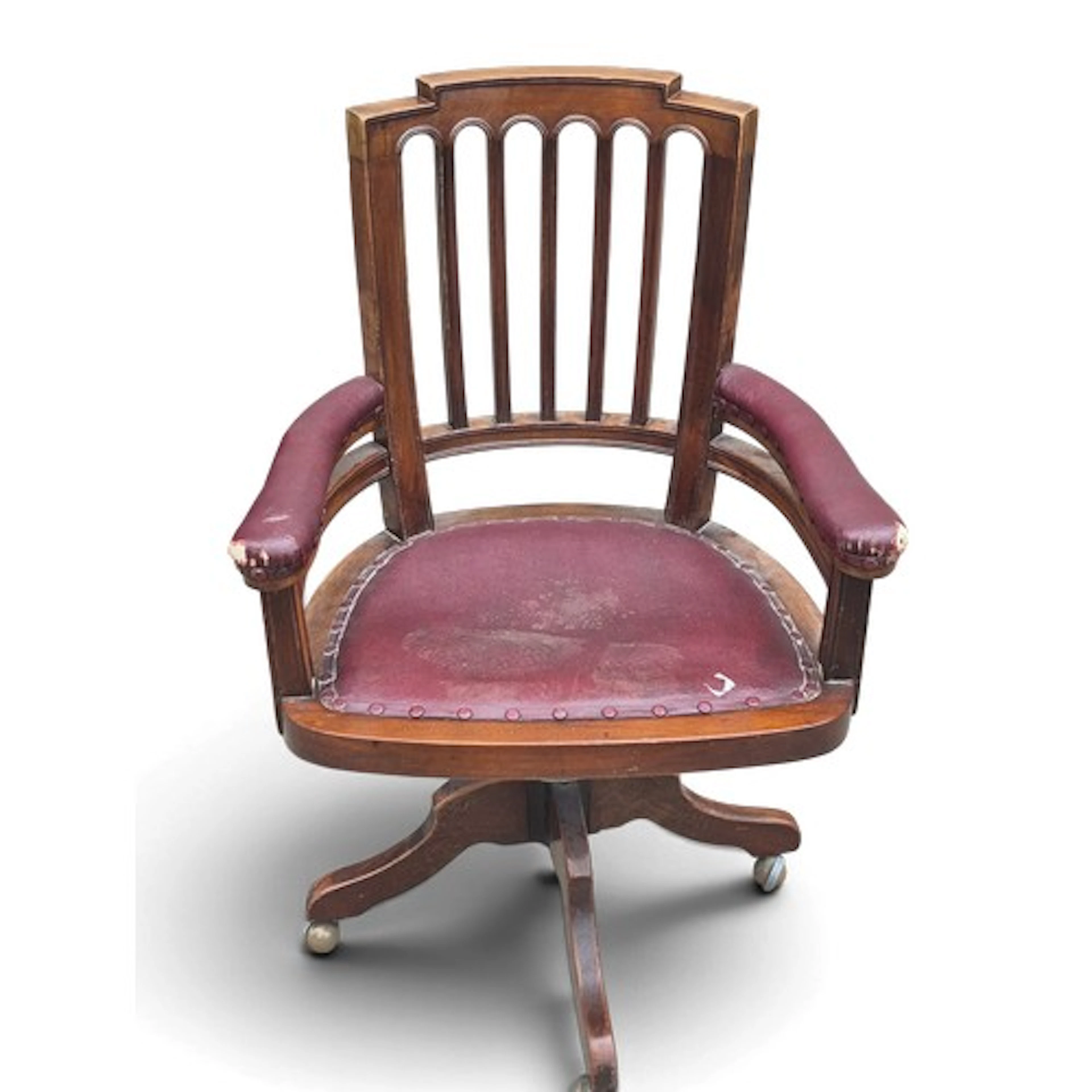 An oak and red leather captains swivel chair. 102 h x 64 w x...